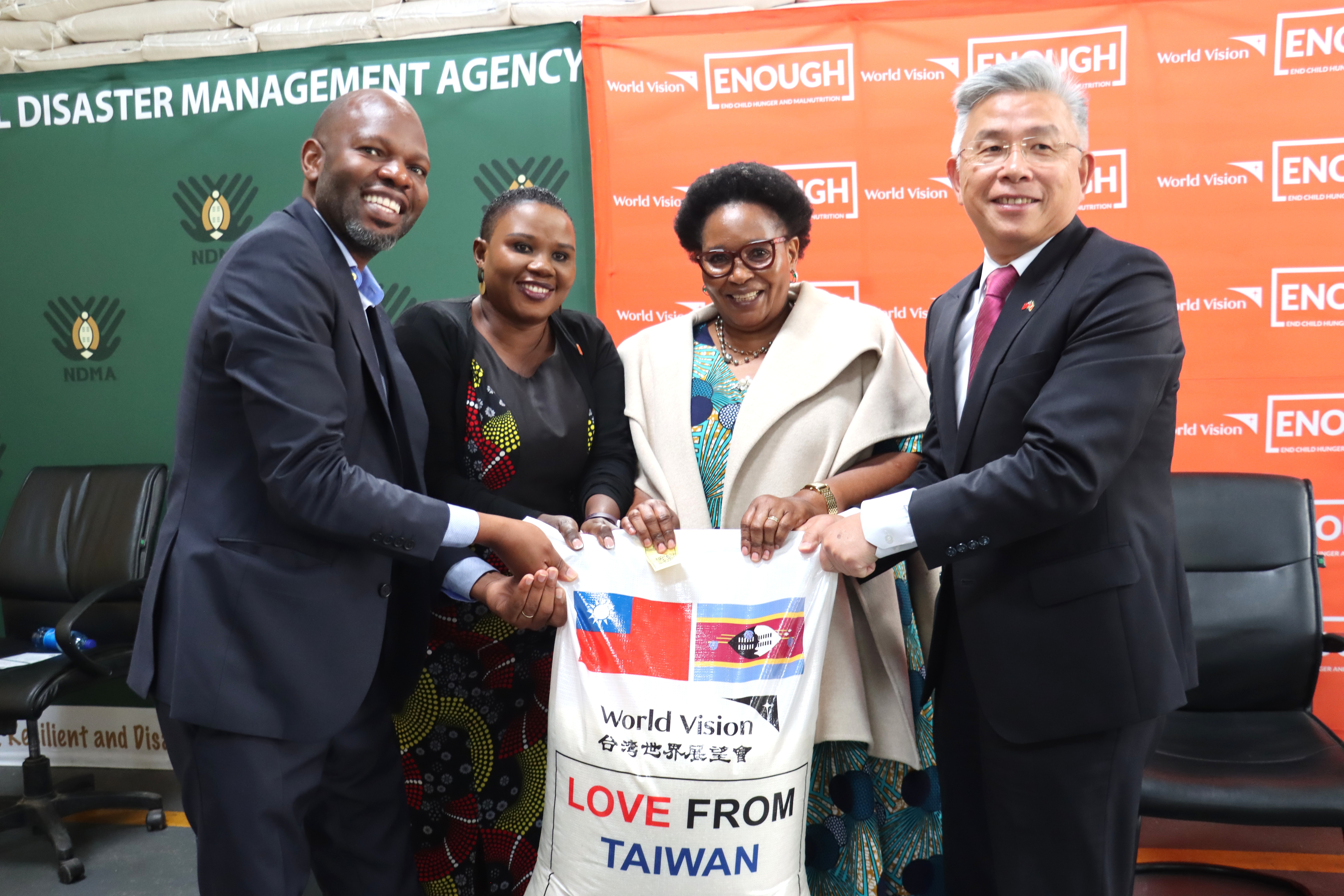 World Vision Eswatini National Director and Taiwan Ambassador Jeremy Liang hand over rice to the National Disaster Management Agency