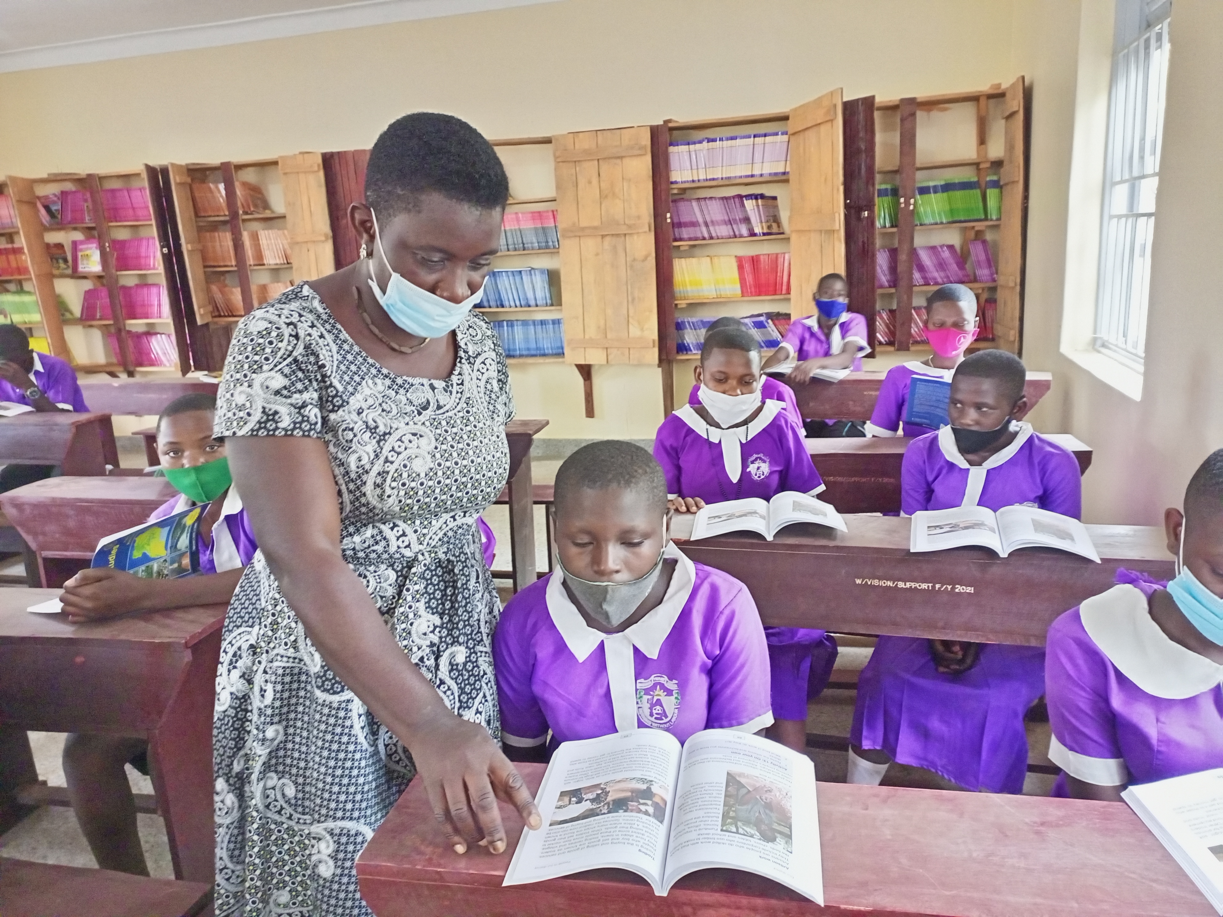 World Vision Uganda supports reading through community literacy centres.