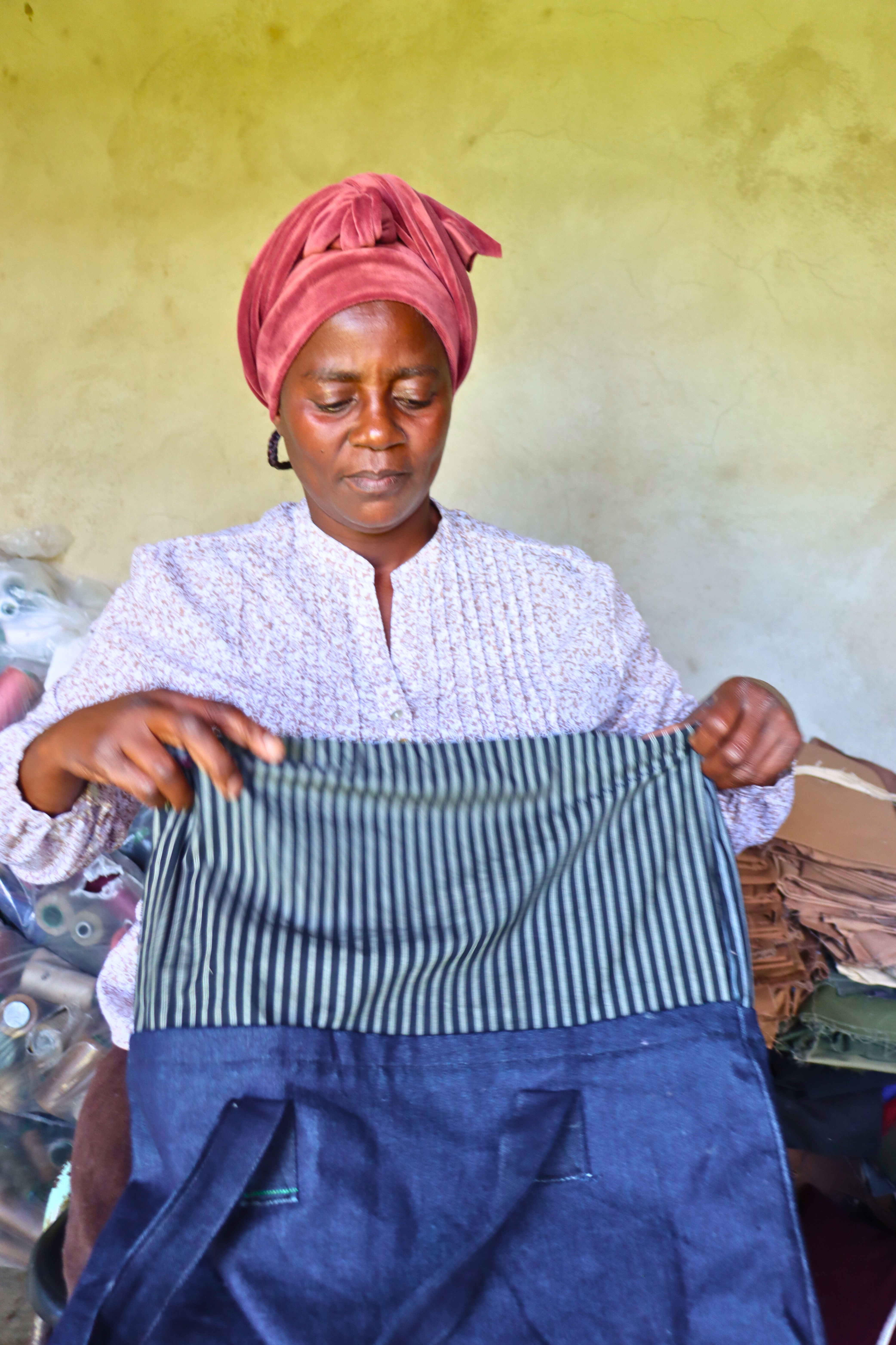 Nonhlanhla holding one of her finished orders ready to be sent to a customer.