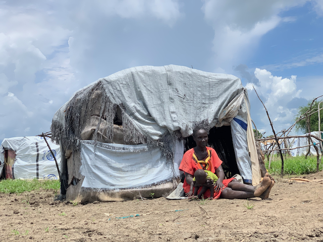 Aluel outside her makeshift home