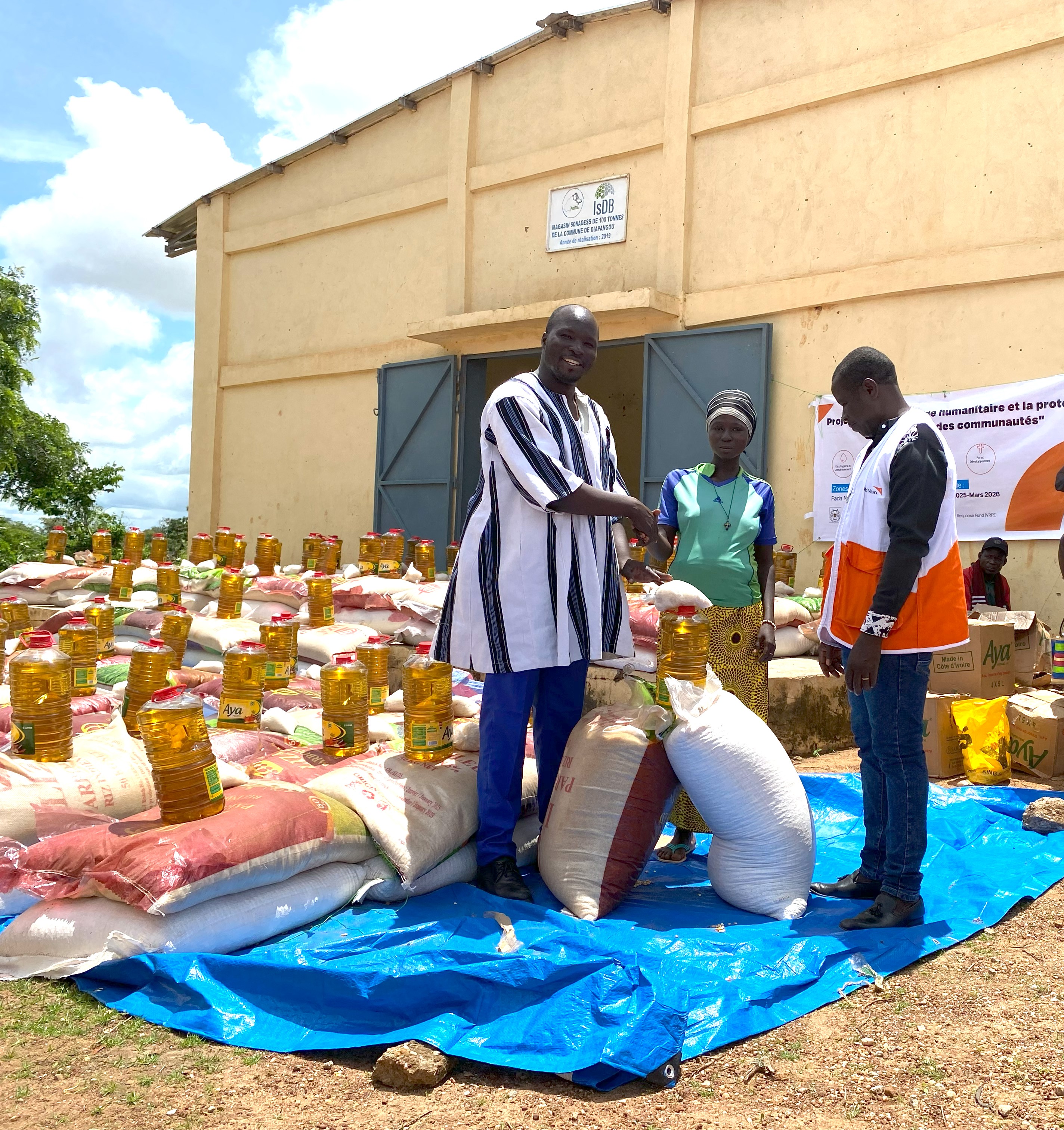 A female head of household receiving her food kit