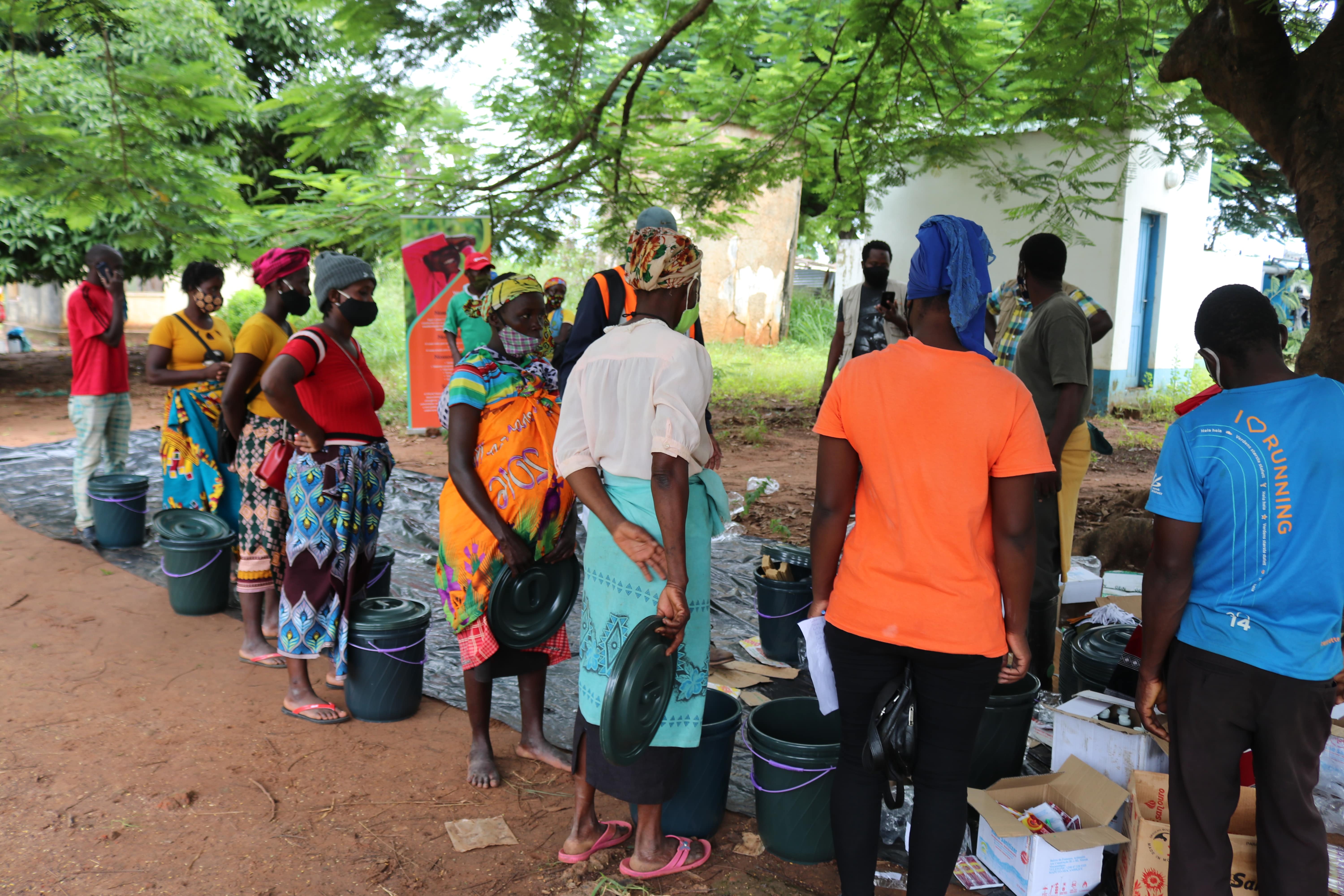 Beneficiaries are standing in queue to receive their kits