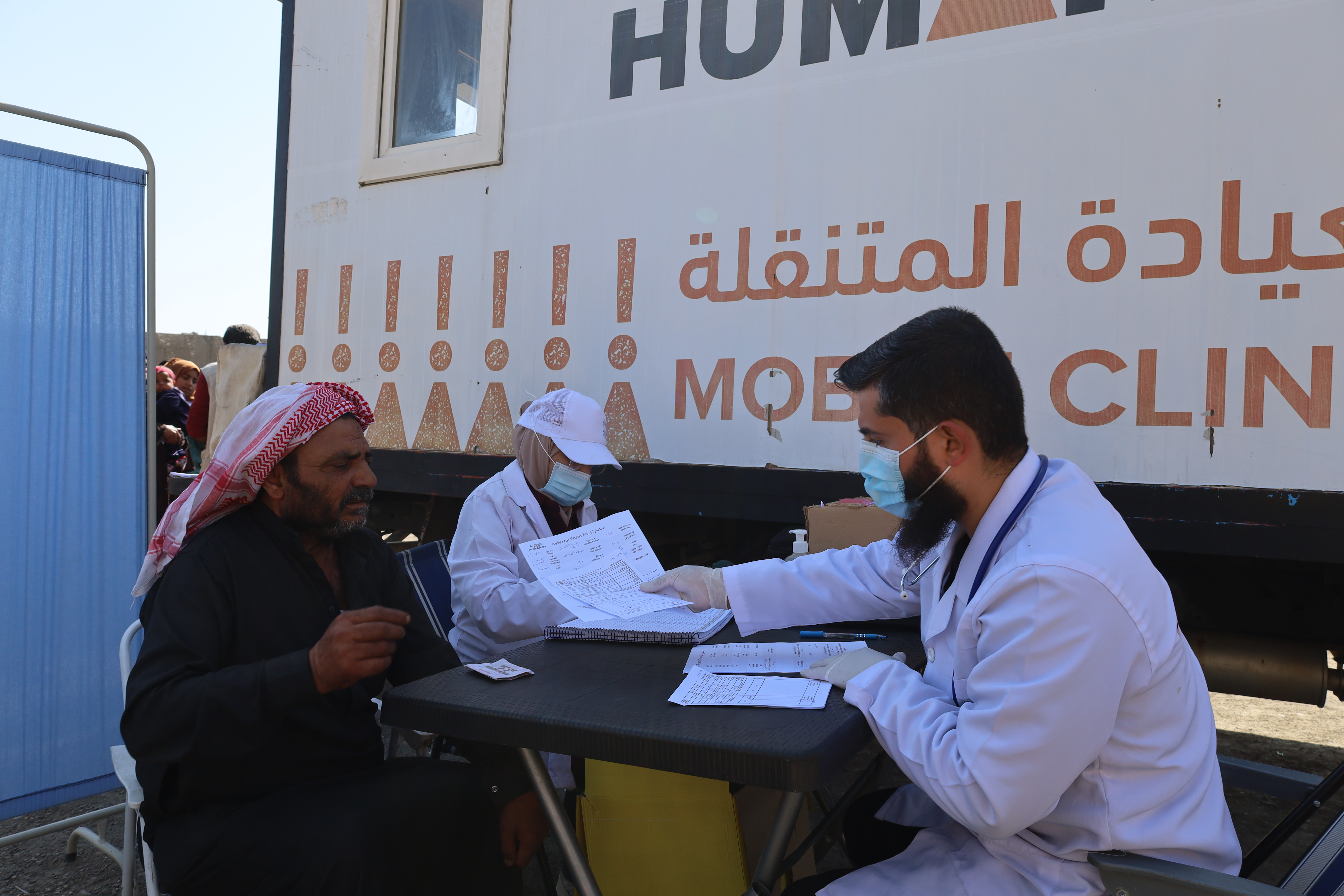 : Photo of Haitham* getting service needed at partner, Action For Humanity mobile clinic.