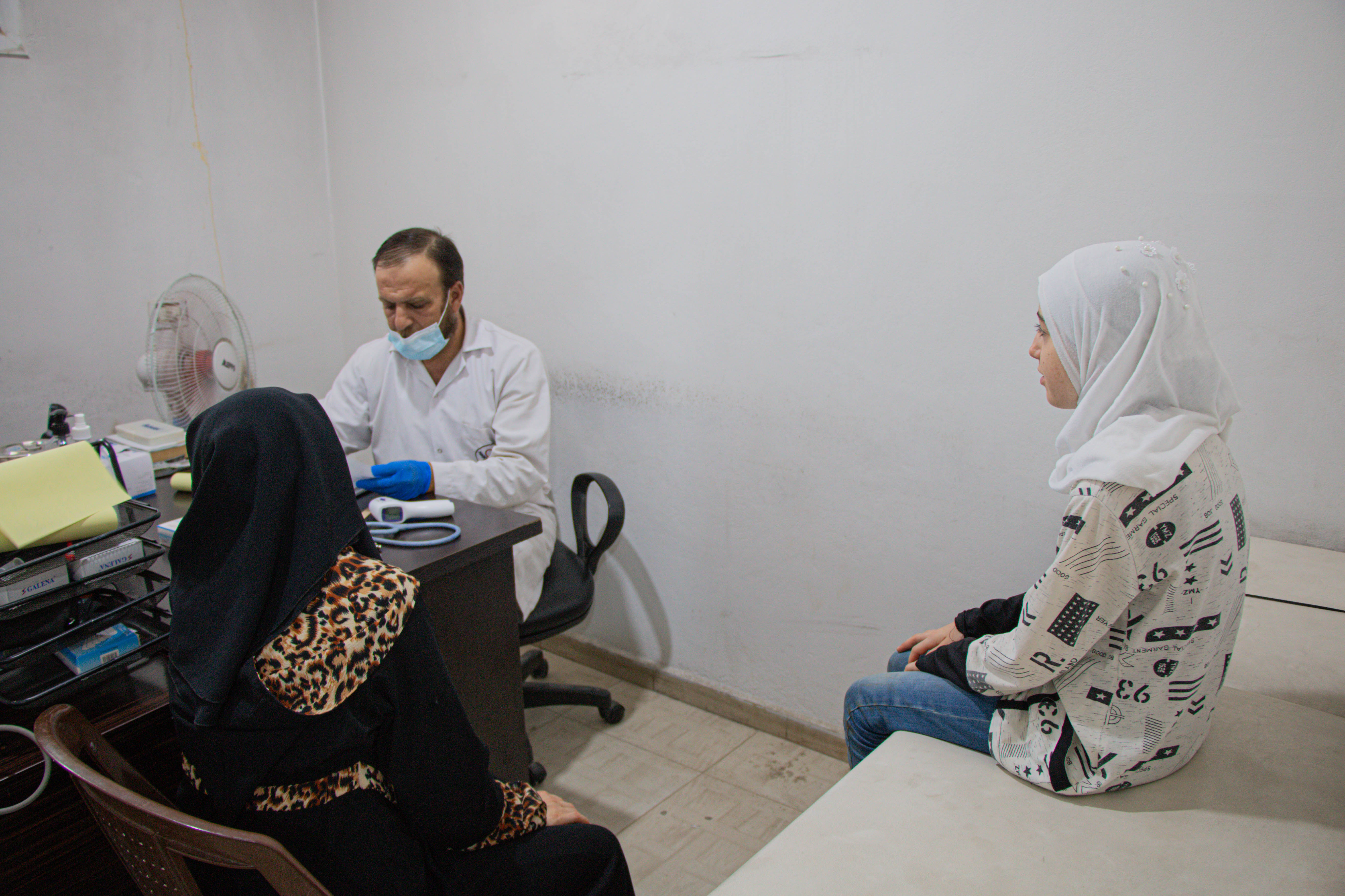 Amira and her daughter during a consultation. Syria Relief and Development, World Vision Syria Response Partner