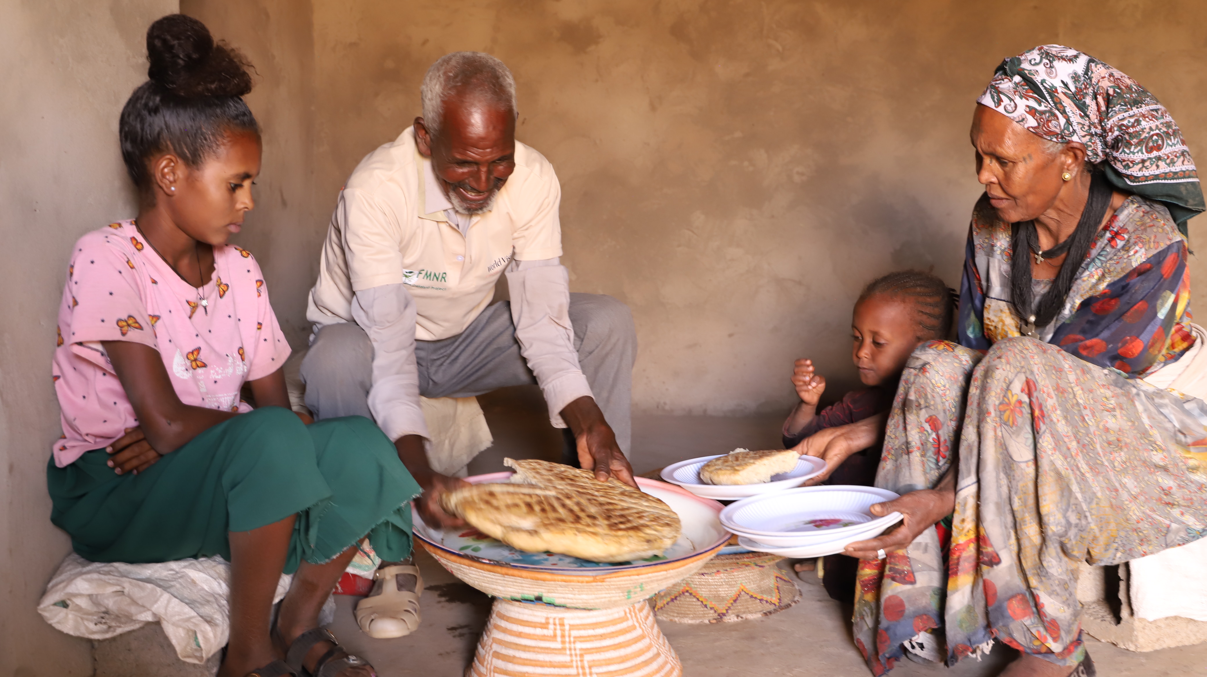 Gebregzihabeher and his family sharing a meal