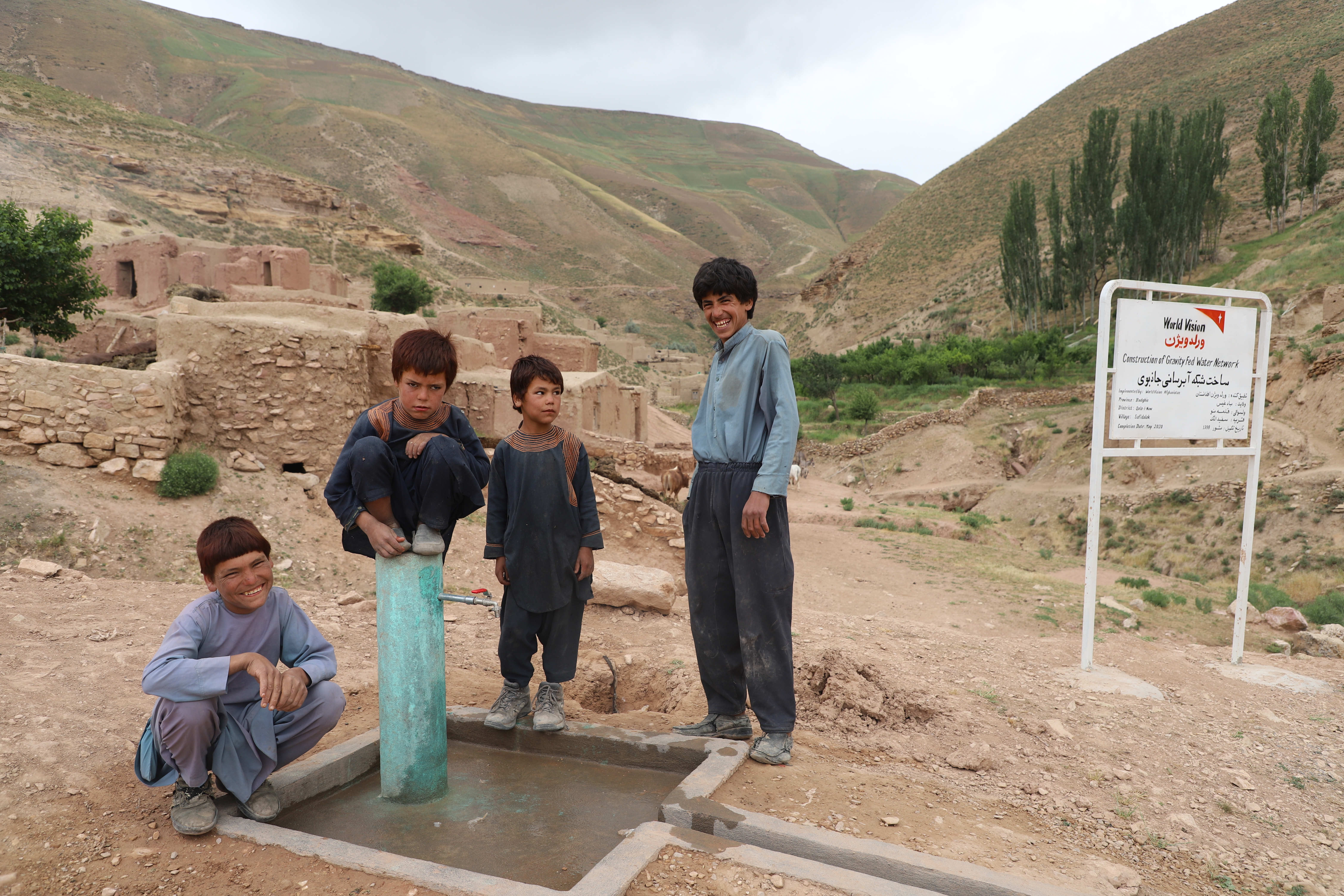 Ahmad and his friends close to water tap.