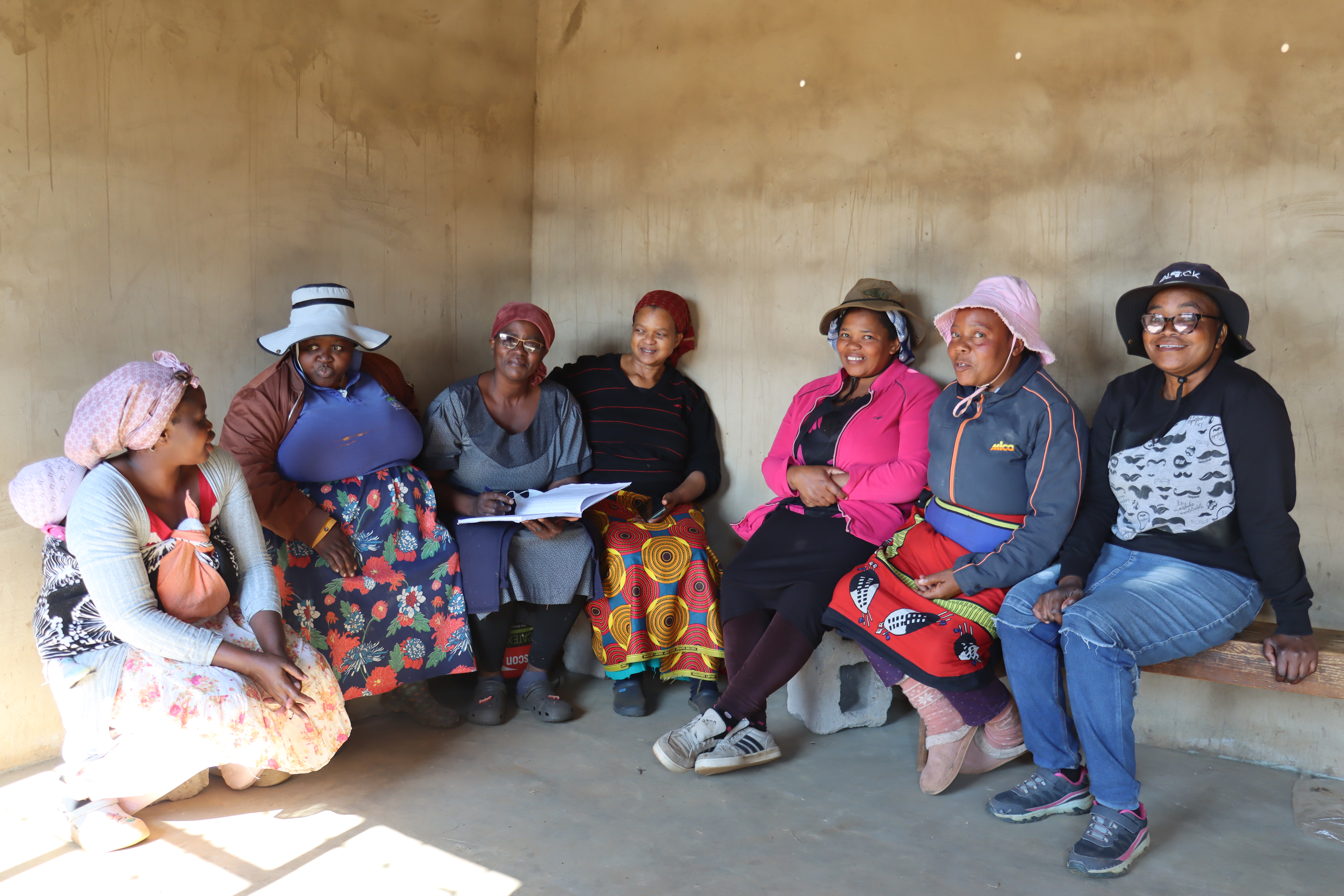 Nonhlanhla Kunene with other members of Mahamba Piggery during one of their meetings. 