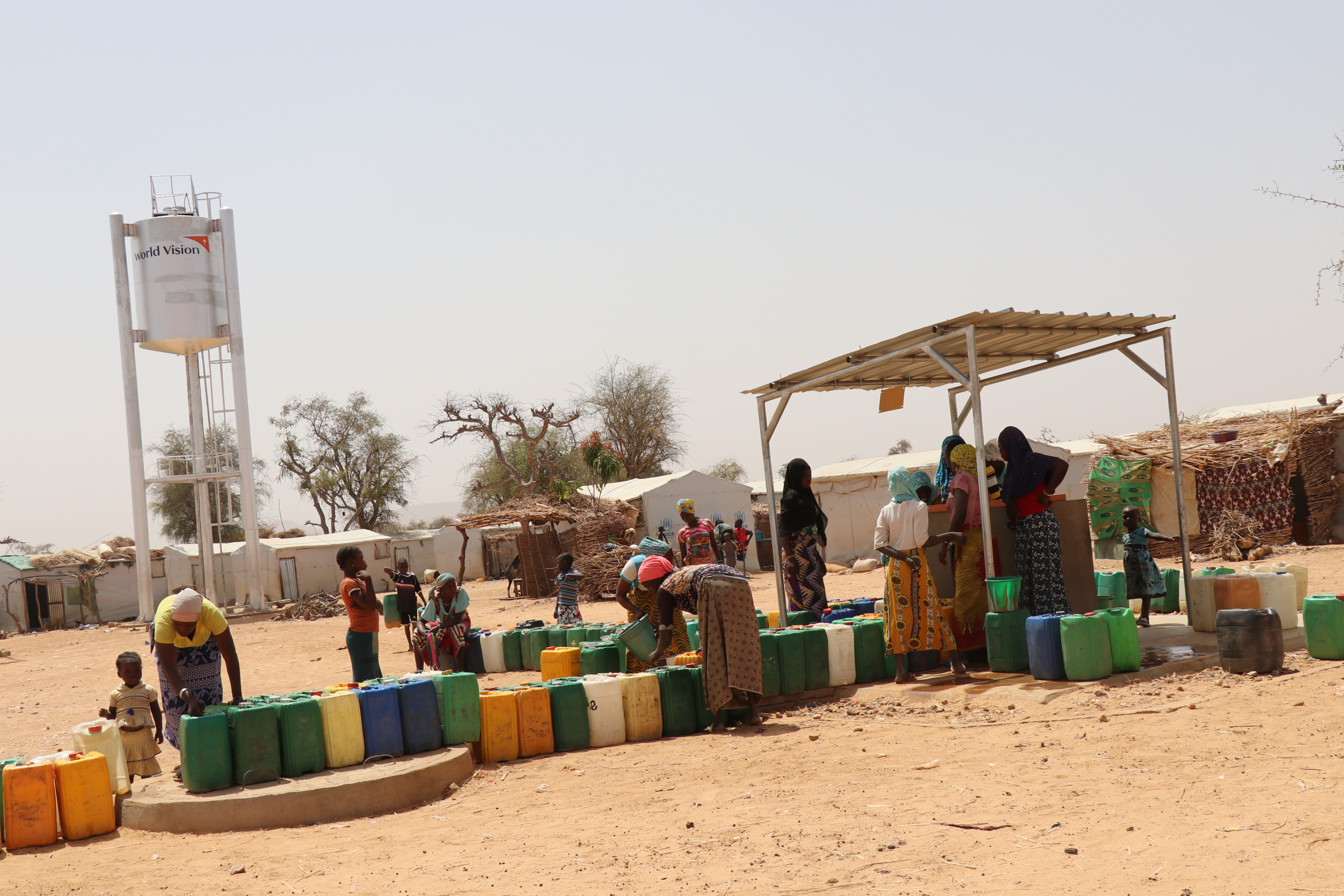 A scene of women taking water