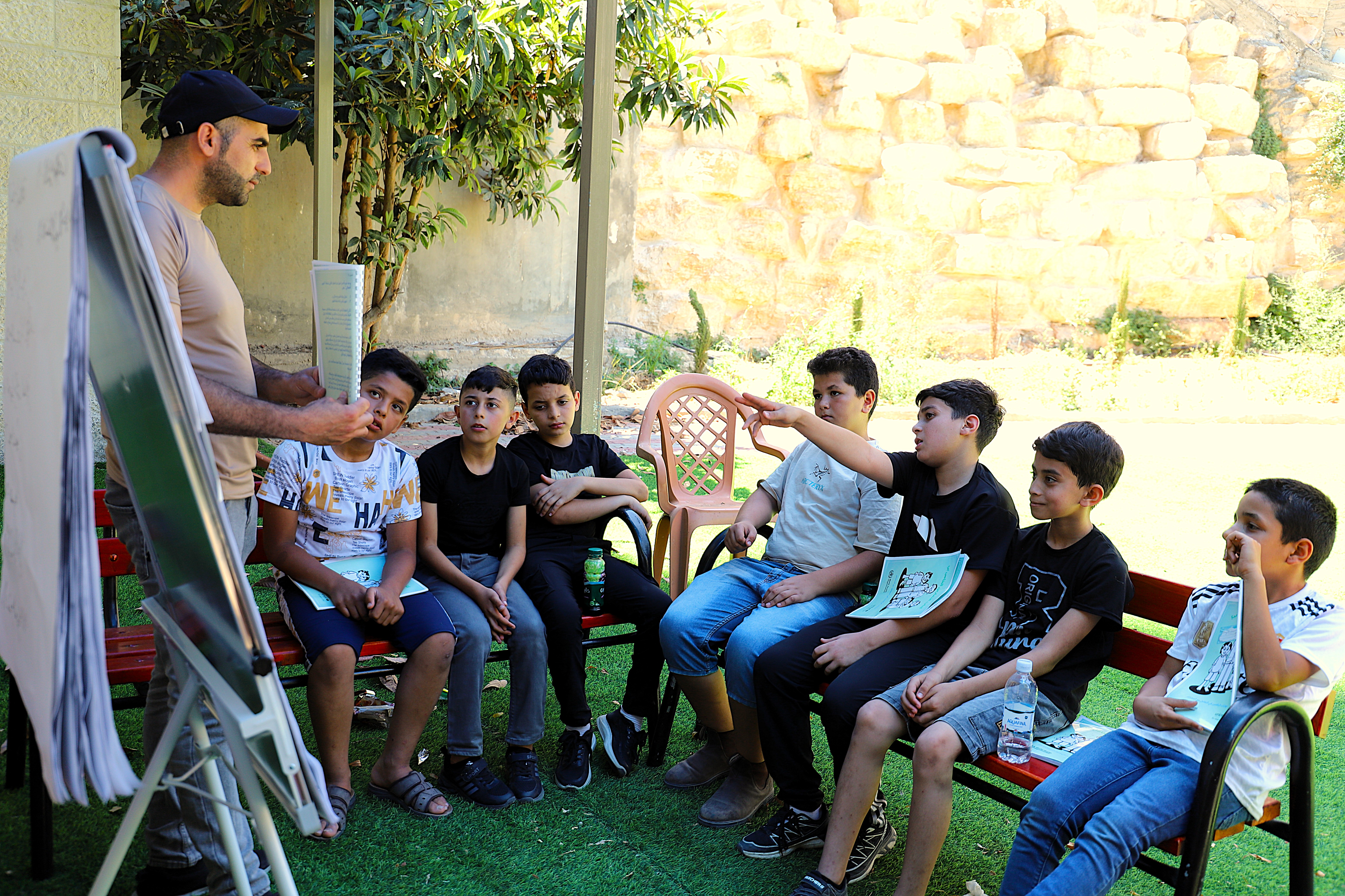 A group of adolescents during a EASE session in the central West Bank in August 2025