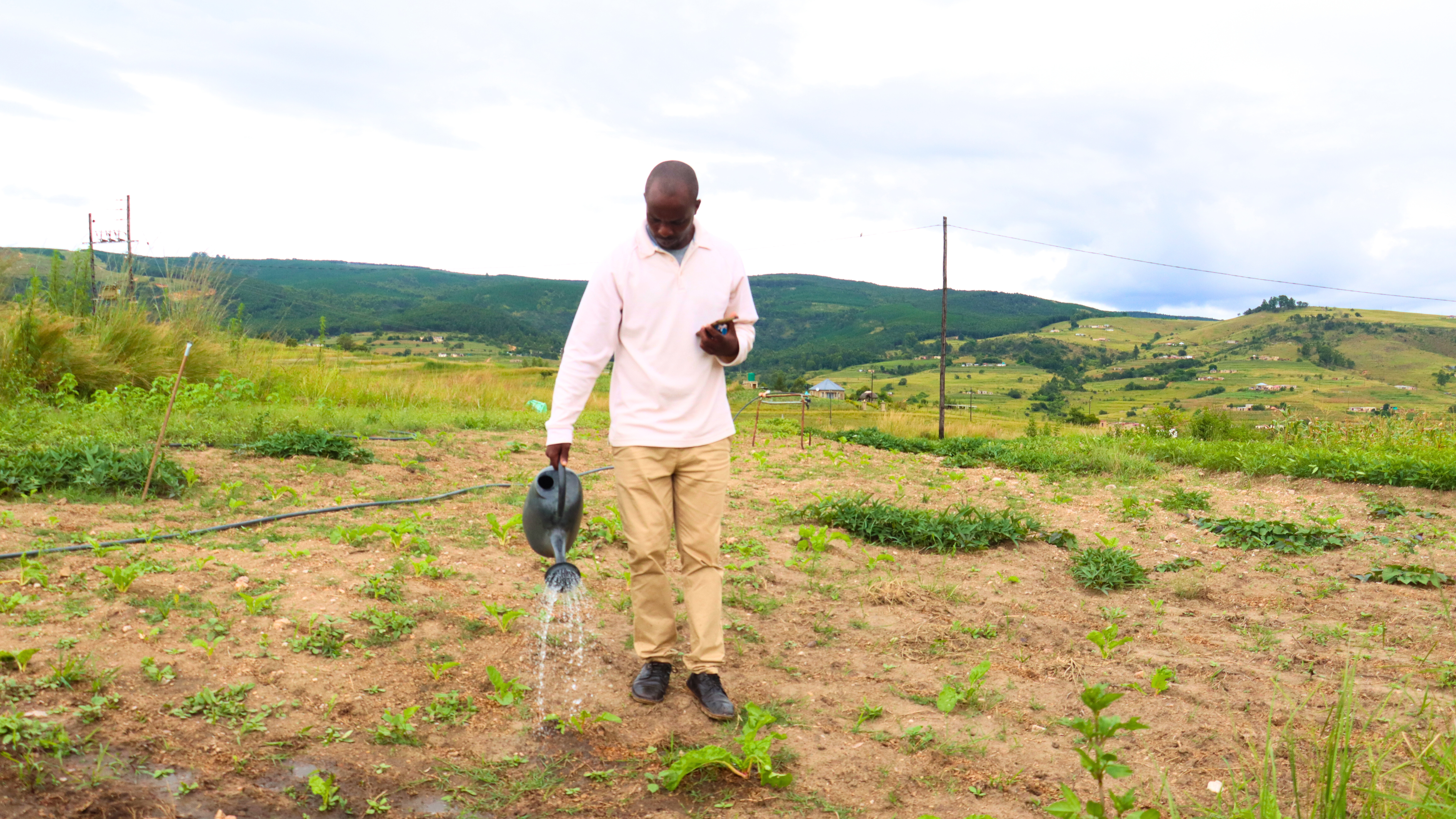 Muzi Masuku, a teacher at the school has a backyard garden at the teachers' quarters through a World Vision supported water system.