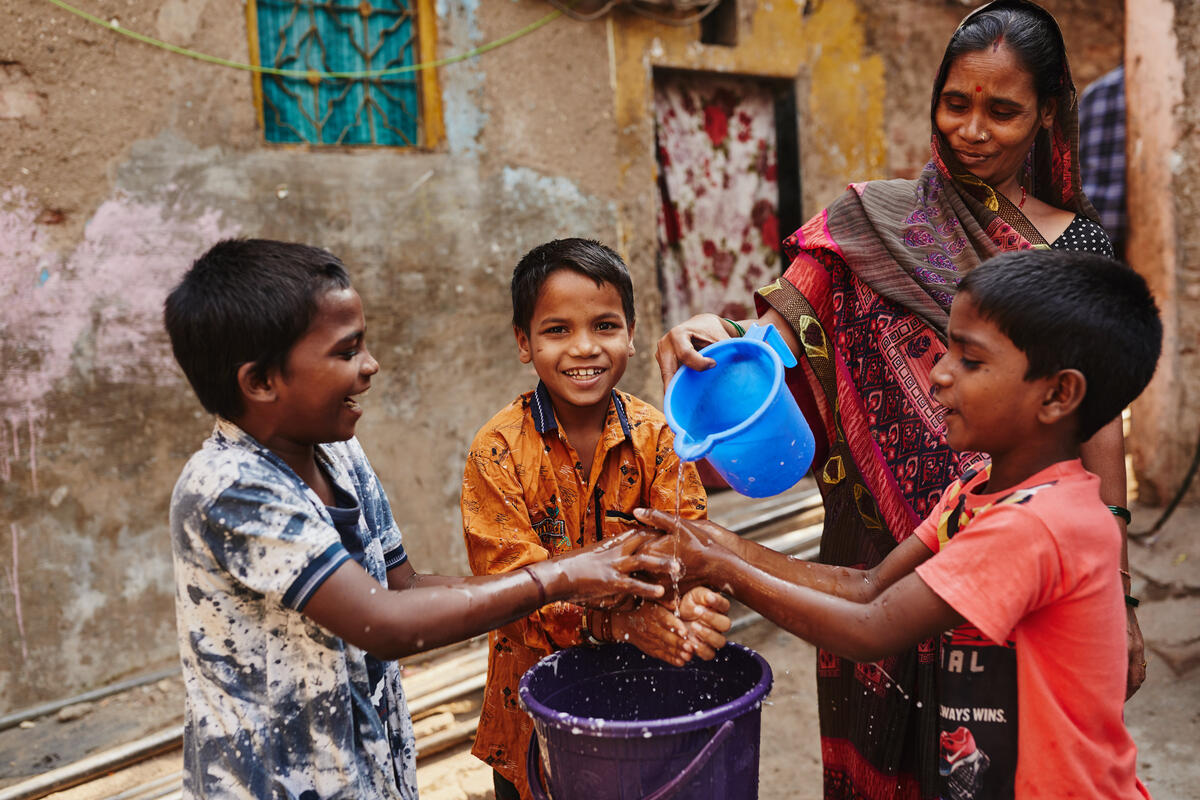 children in India wash their hands