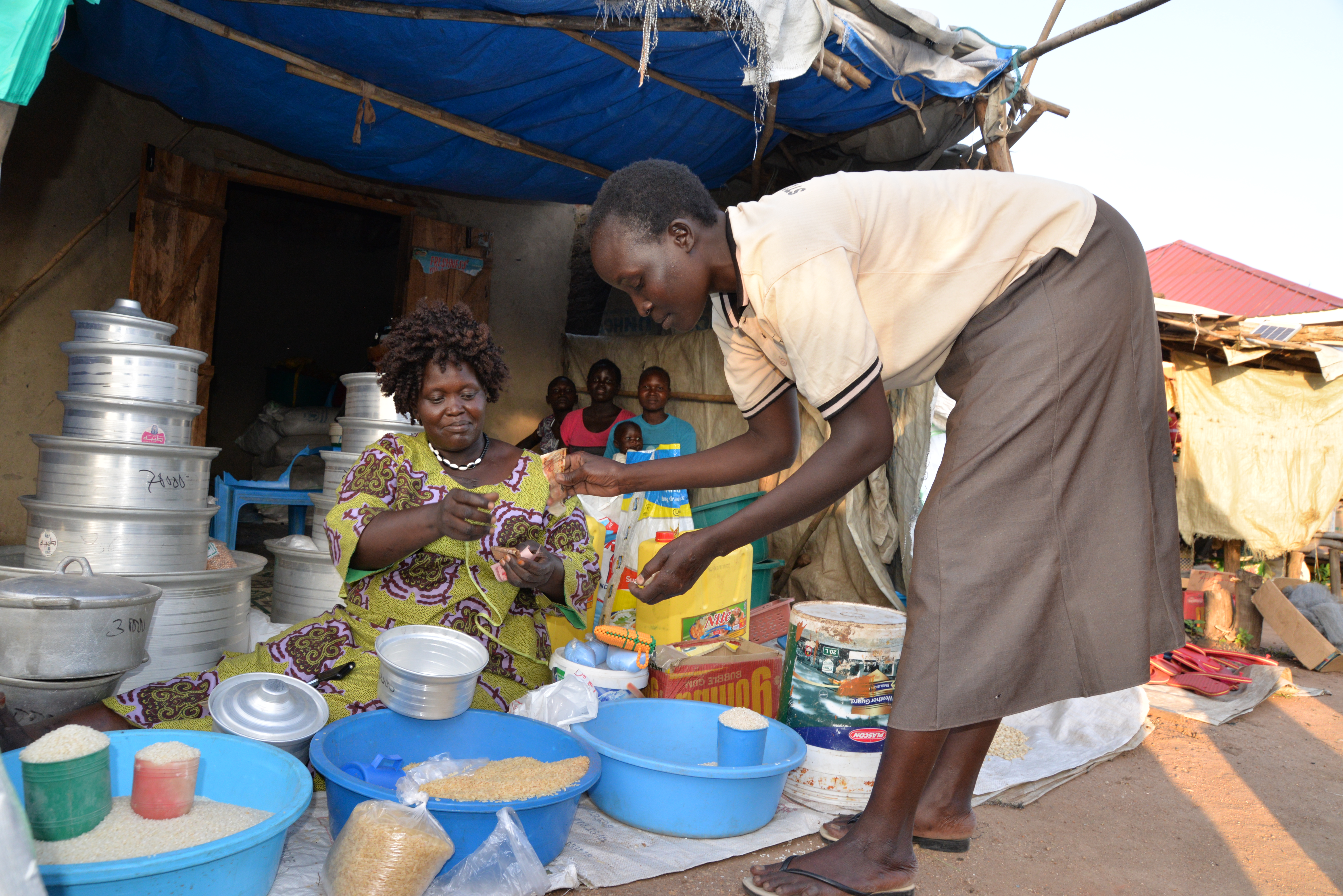 Jackline Loria, attending to a customer at her business