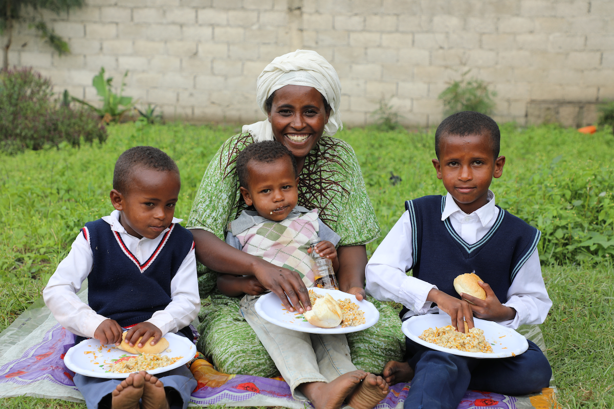 Jemila feeds her children nutritious food at home.