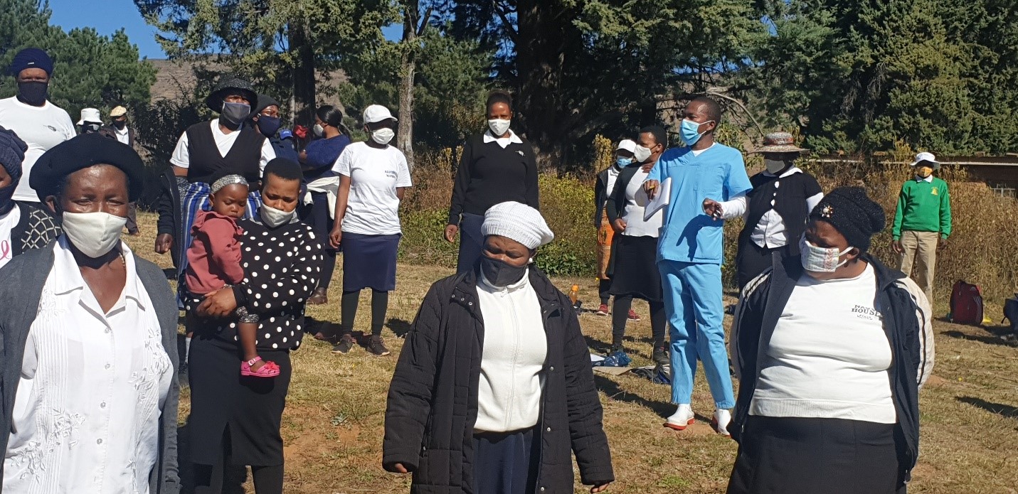 Assitant nurse kametse training village health workers on how to adhere to COVID-19 guidelines