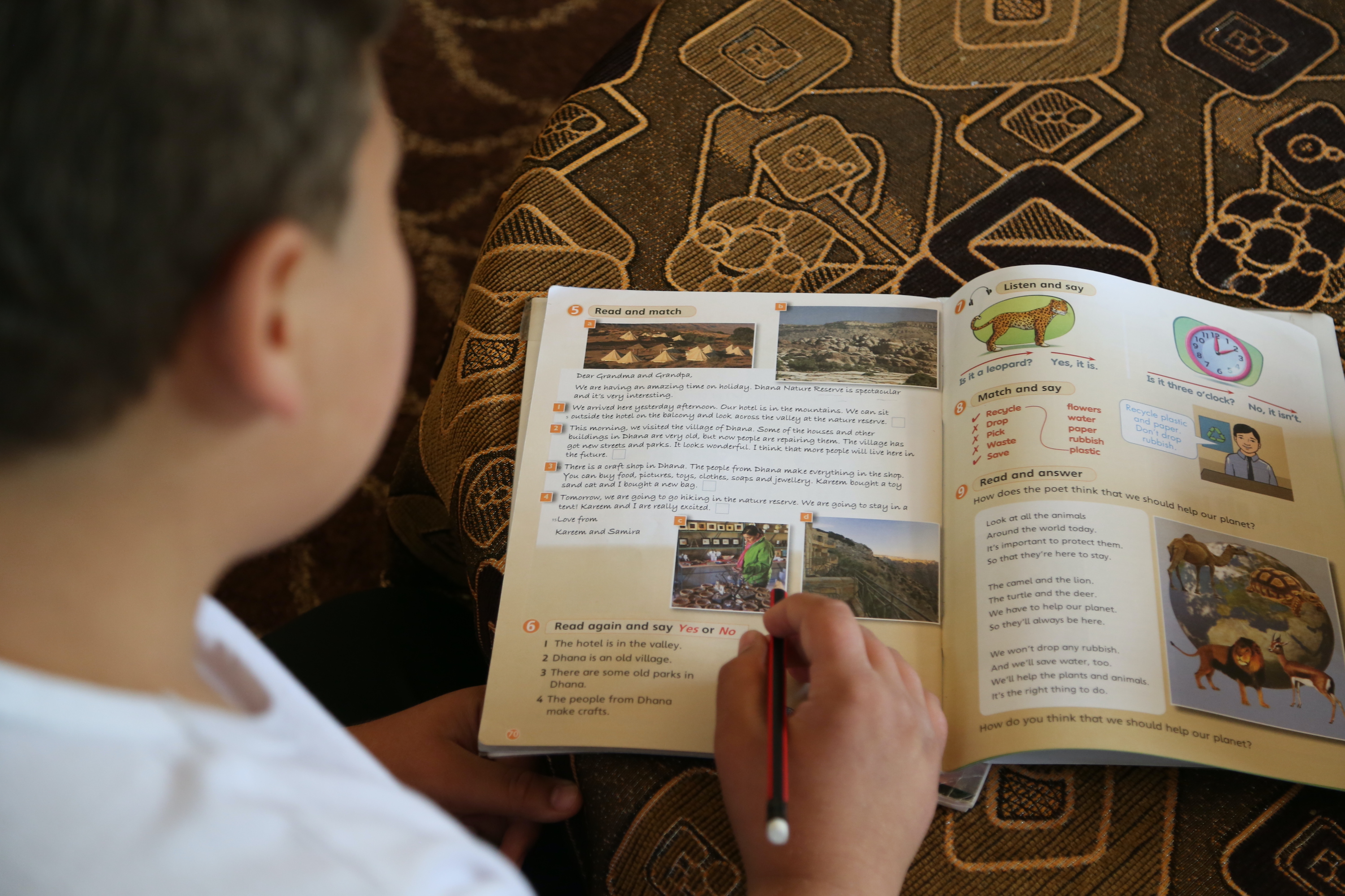 Mohammed, 12, takes English lessons as part of World Vision's remedial education project in northern Jordan