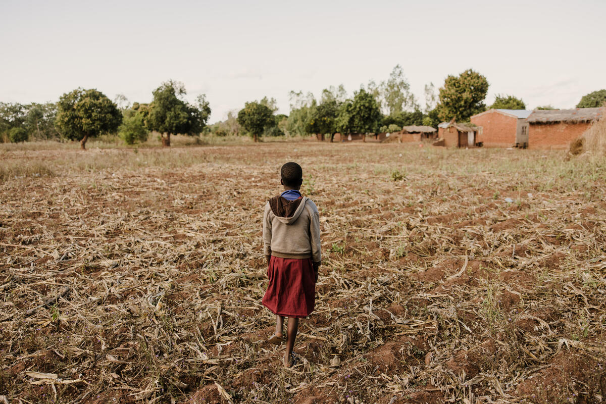 Girl standing in a field