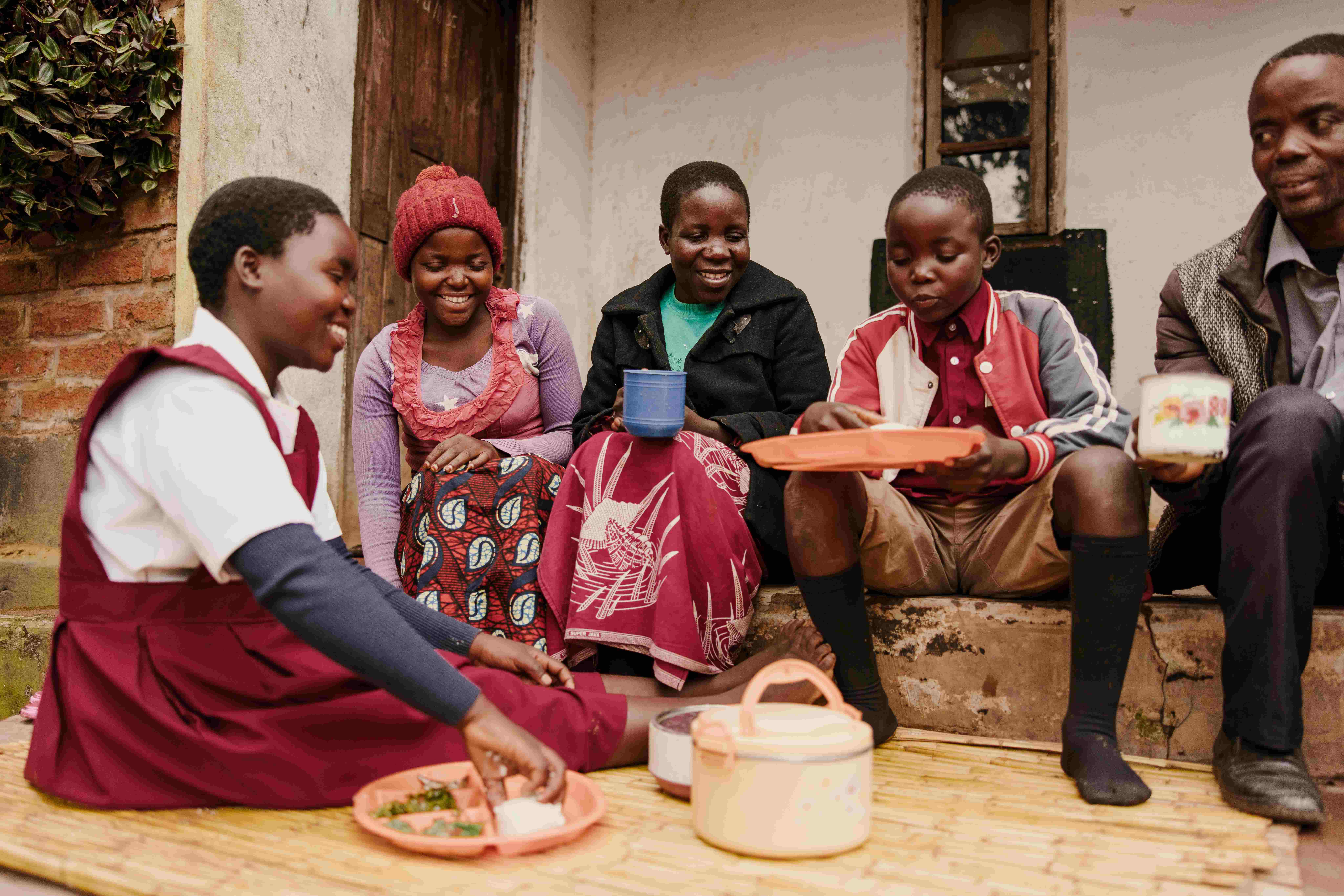students eating in Malawi