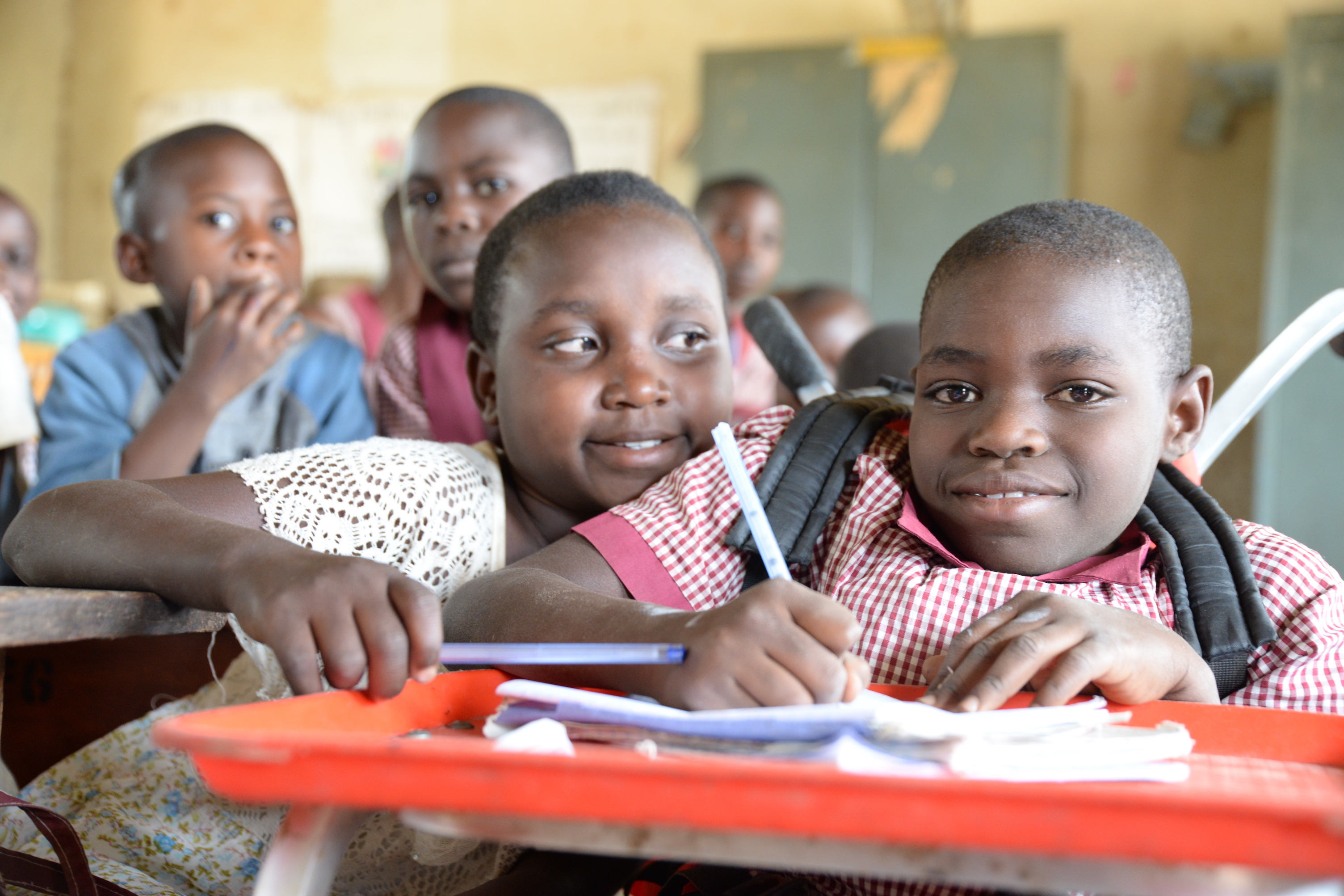 Mariam is able to write better with the support of a tray installed on her wheelchair.