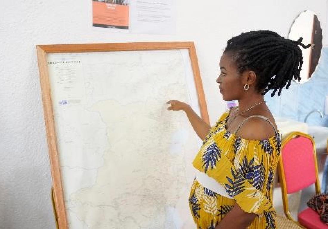 Martine pointing at white board