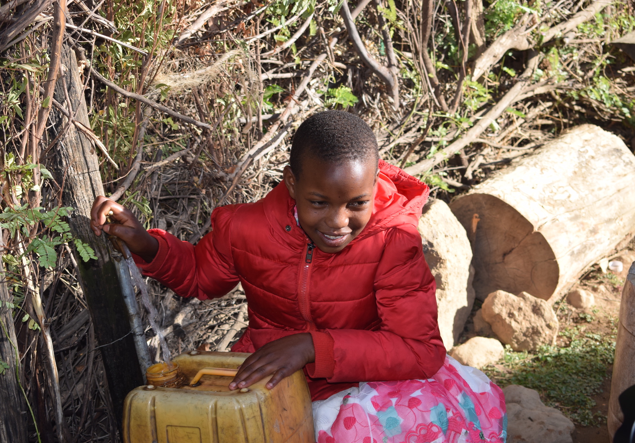Maurine enjoys clean tap water at her home in Chesem village, thanks to funds raised by Addyson.©World Vision/Photo by Sarah Ooko