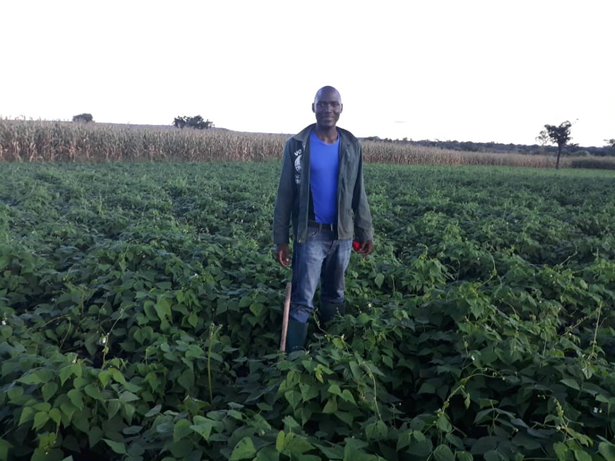 Philip standing in his field