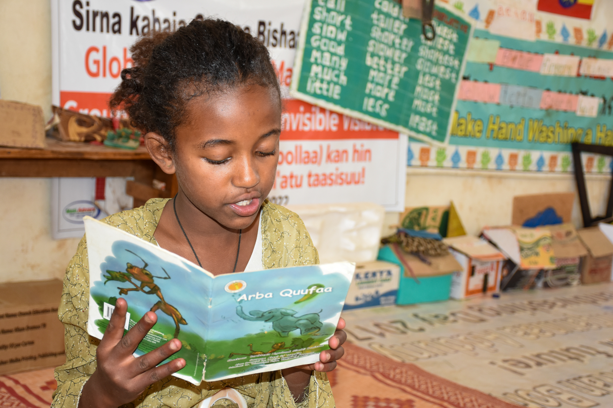 Meron reading a storybook