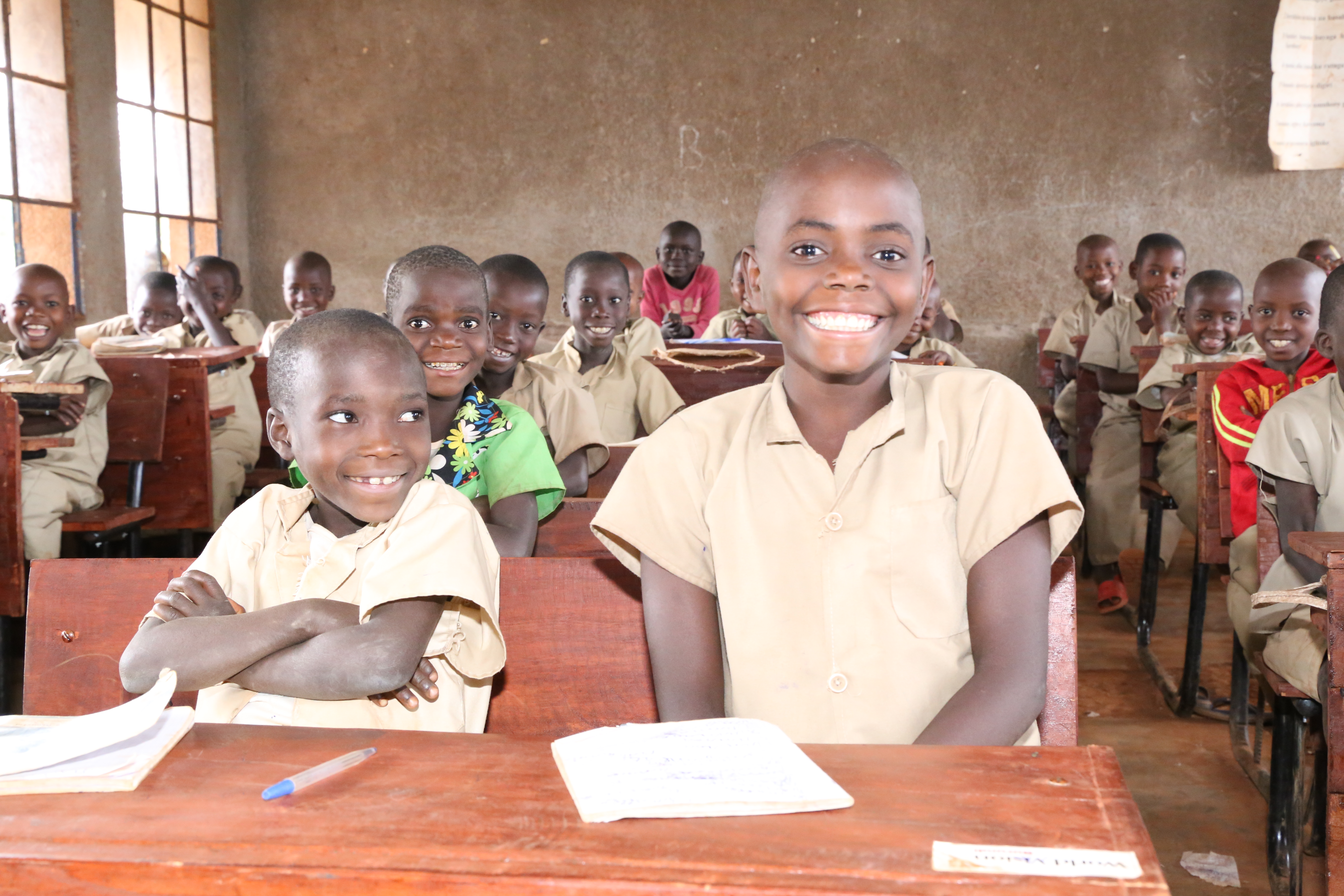 Today, Jeannette and her classmates enjoy learning whilst sitting on a desk