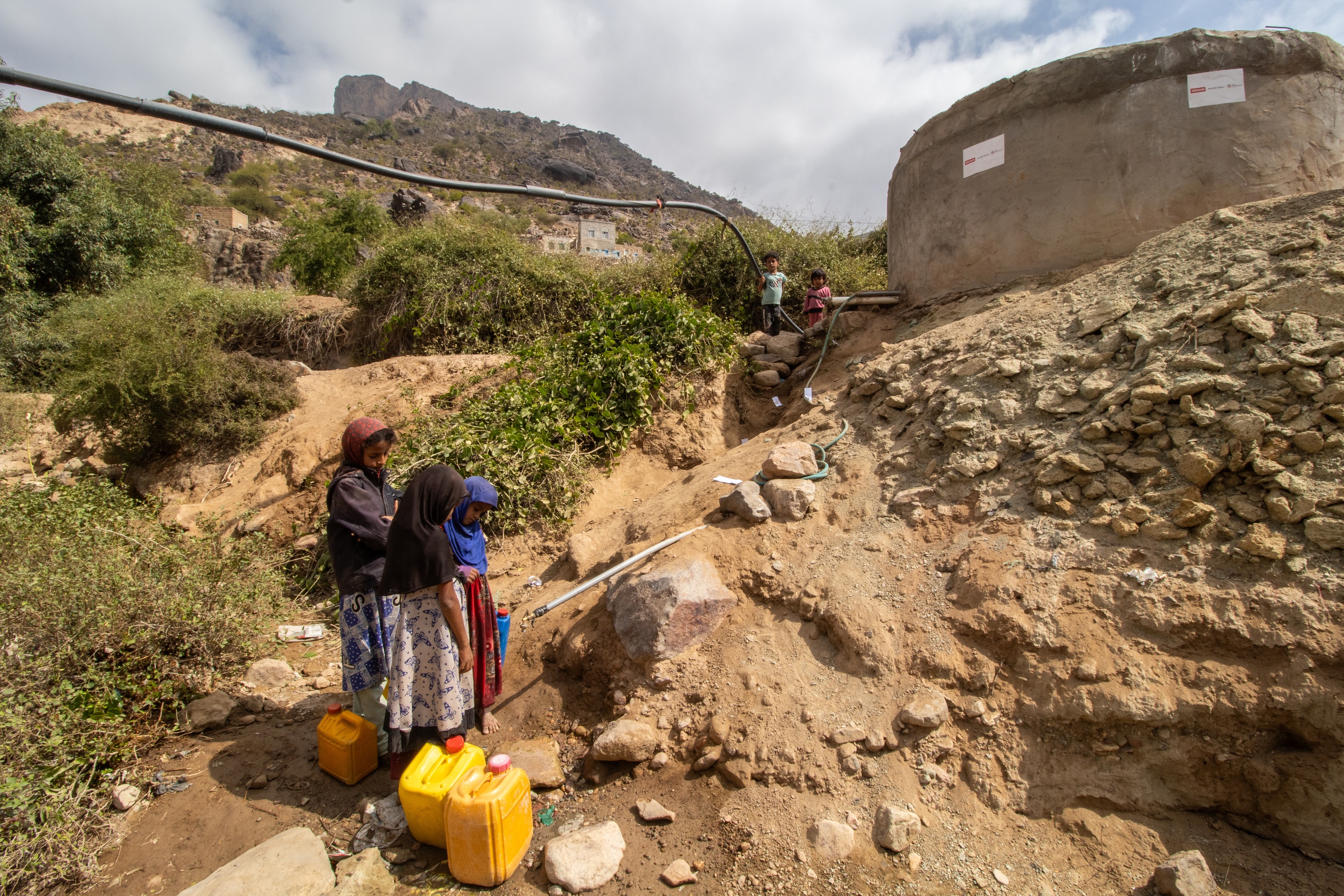 Children collect water from the water source