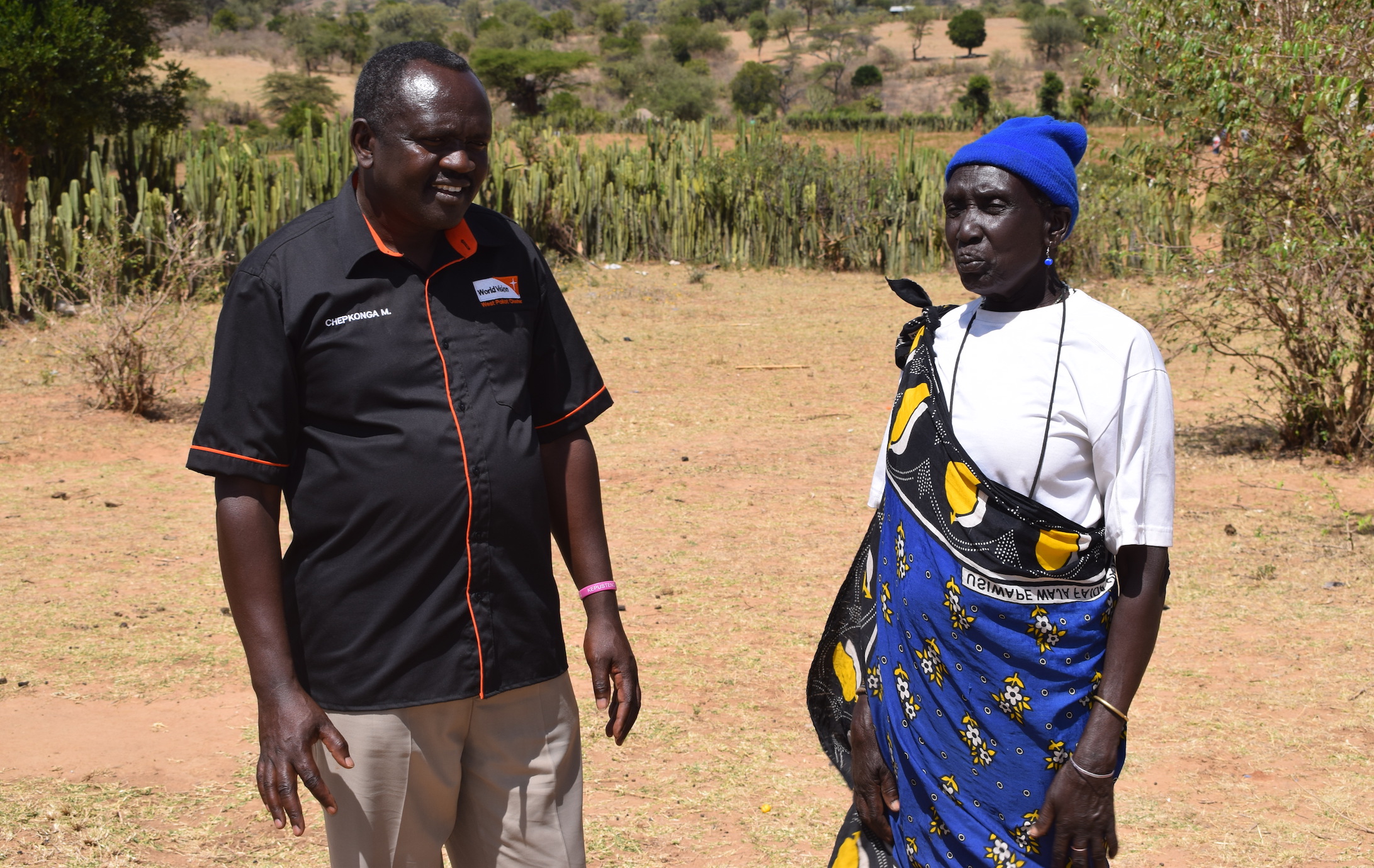 Moses Chepkonga, Child Protection Expert for World Vision in Kenya's West Pokot County congratulates Chepurai for abandoning the FGM practice.© World Vision/Photo by Sarah Ooko. 