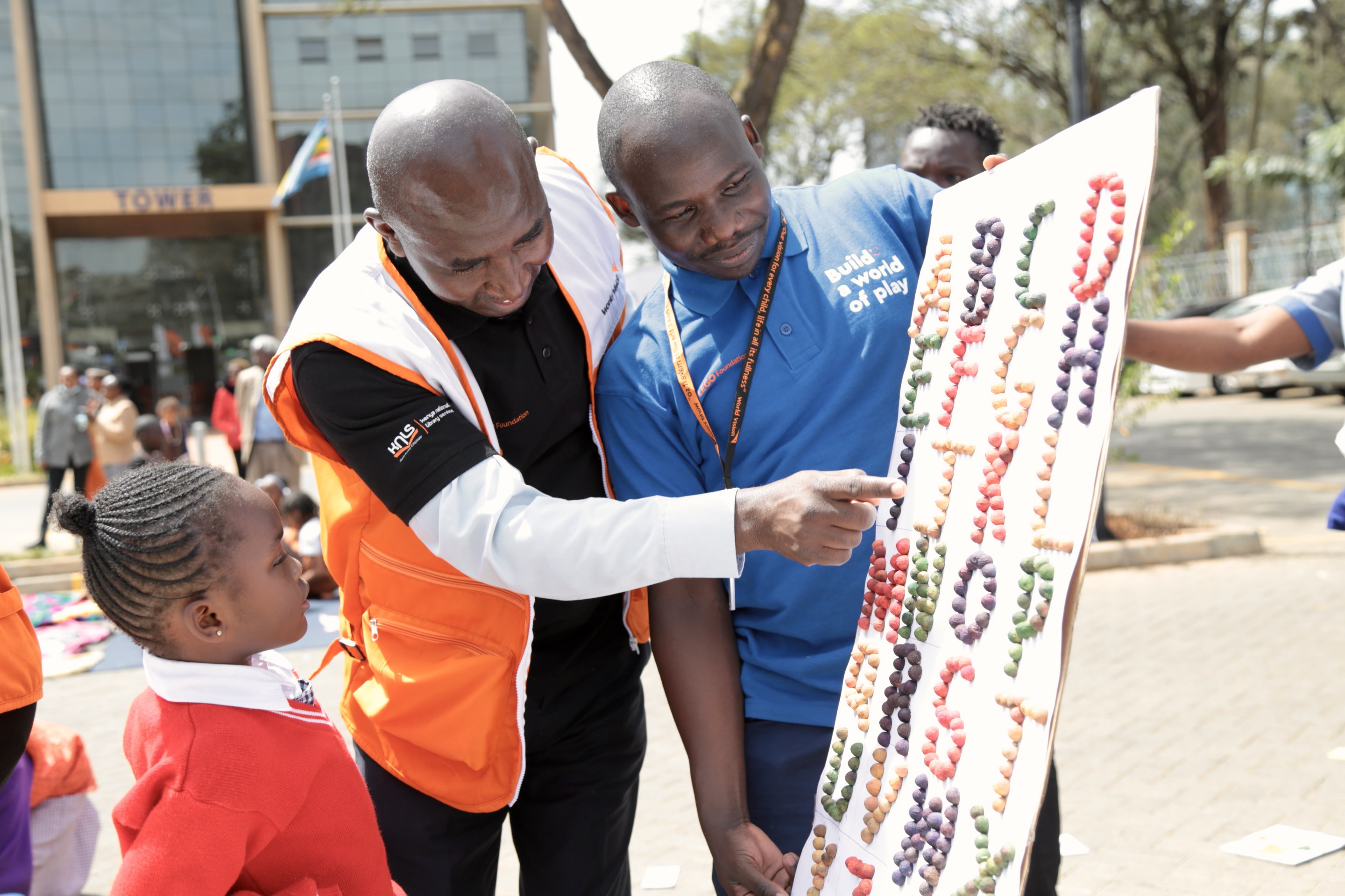 World Vision Kenya Ag National Director Geoffrey Kativa and other World Vision officials enjoyed engaged students like Shirleen in play and learn campaigns 