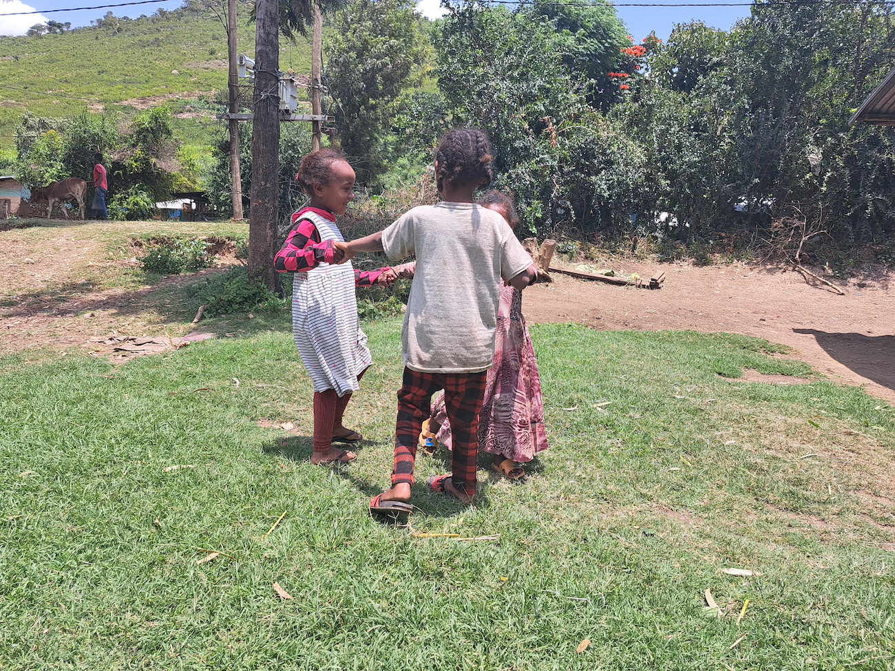 Nani playing with her friends at the back yard