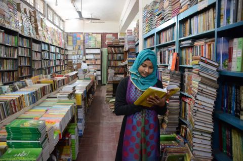 Nasima is in University Library getting preparation for her Graduation Exam