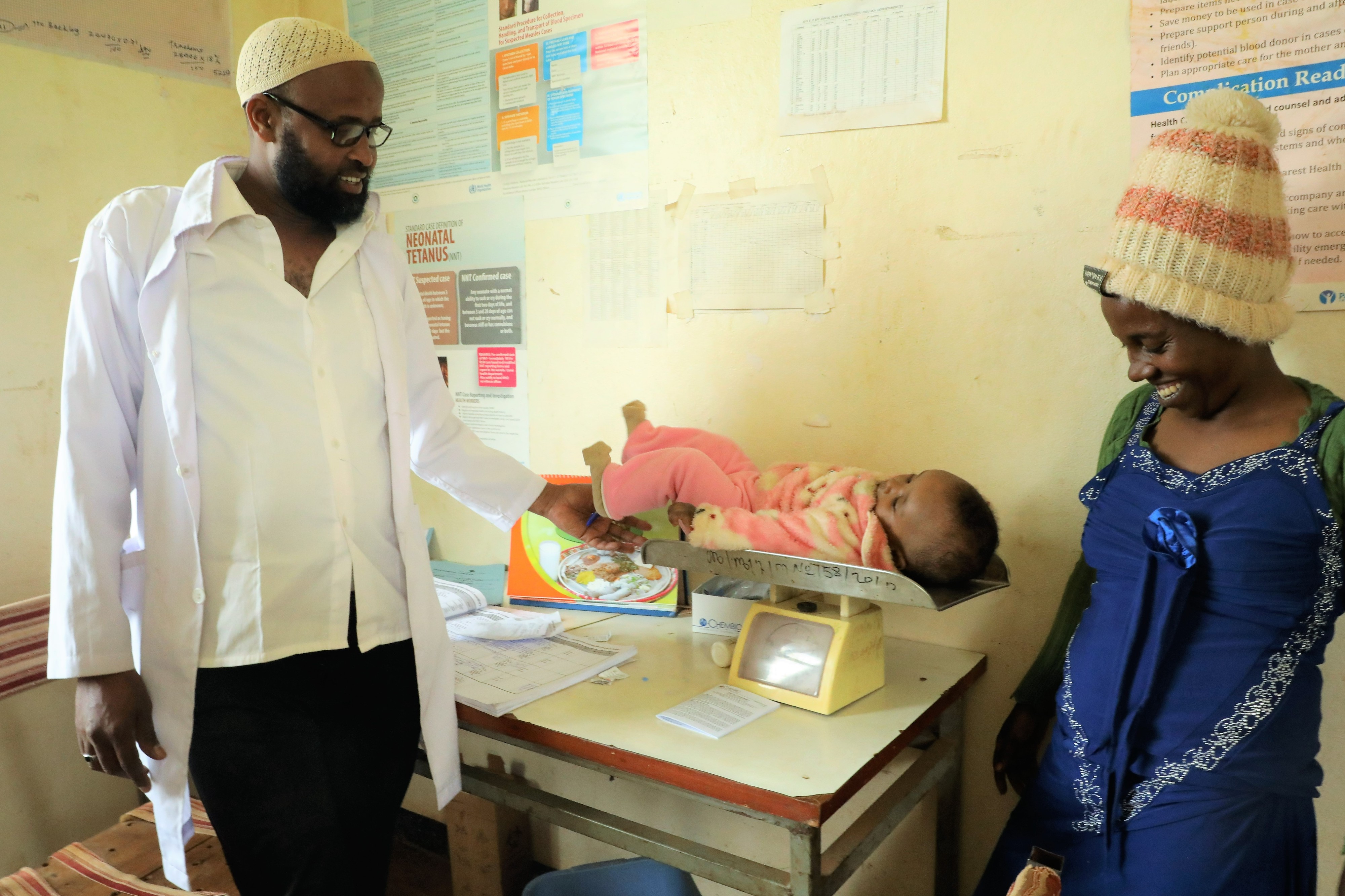 Temelesh child getting weighed 