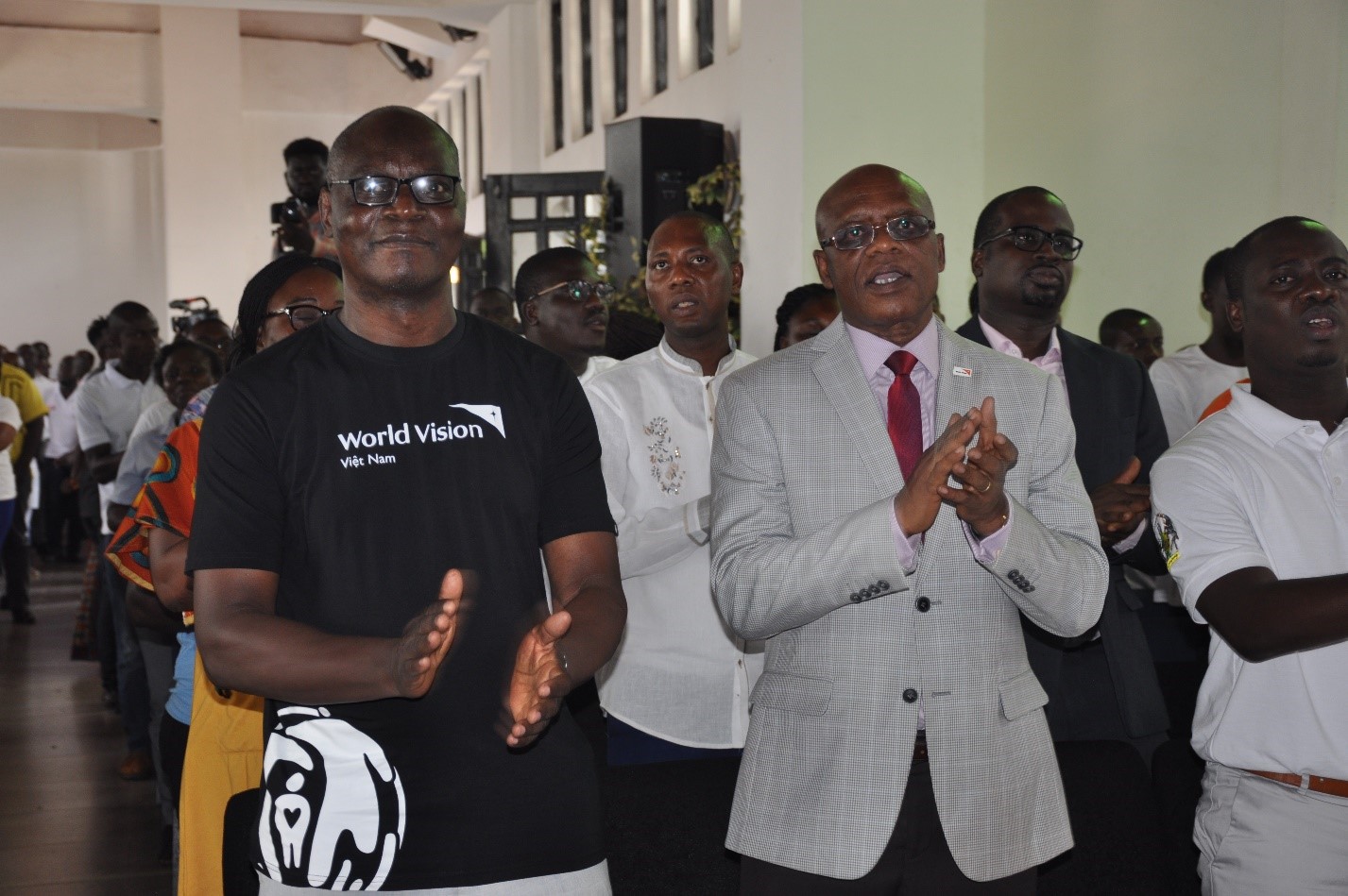 National Director Dickens Thunde and Board Chair Emmanuel Baba Mahama celebrating with a section of the congregation