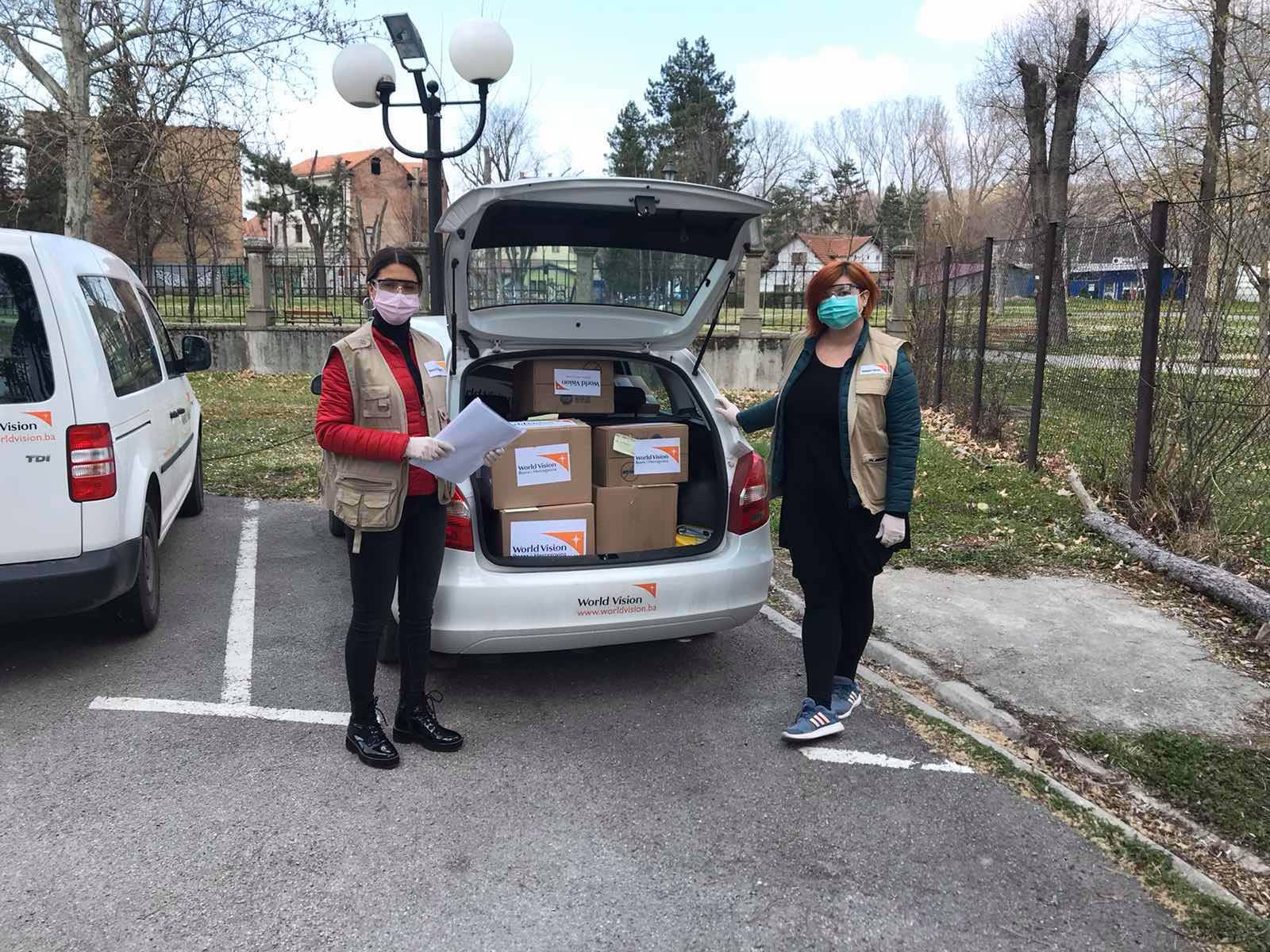 Nina Zupan, World Vision BiH Community Facilitator next to a loaded car before going to the field