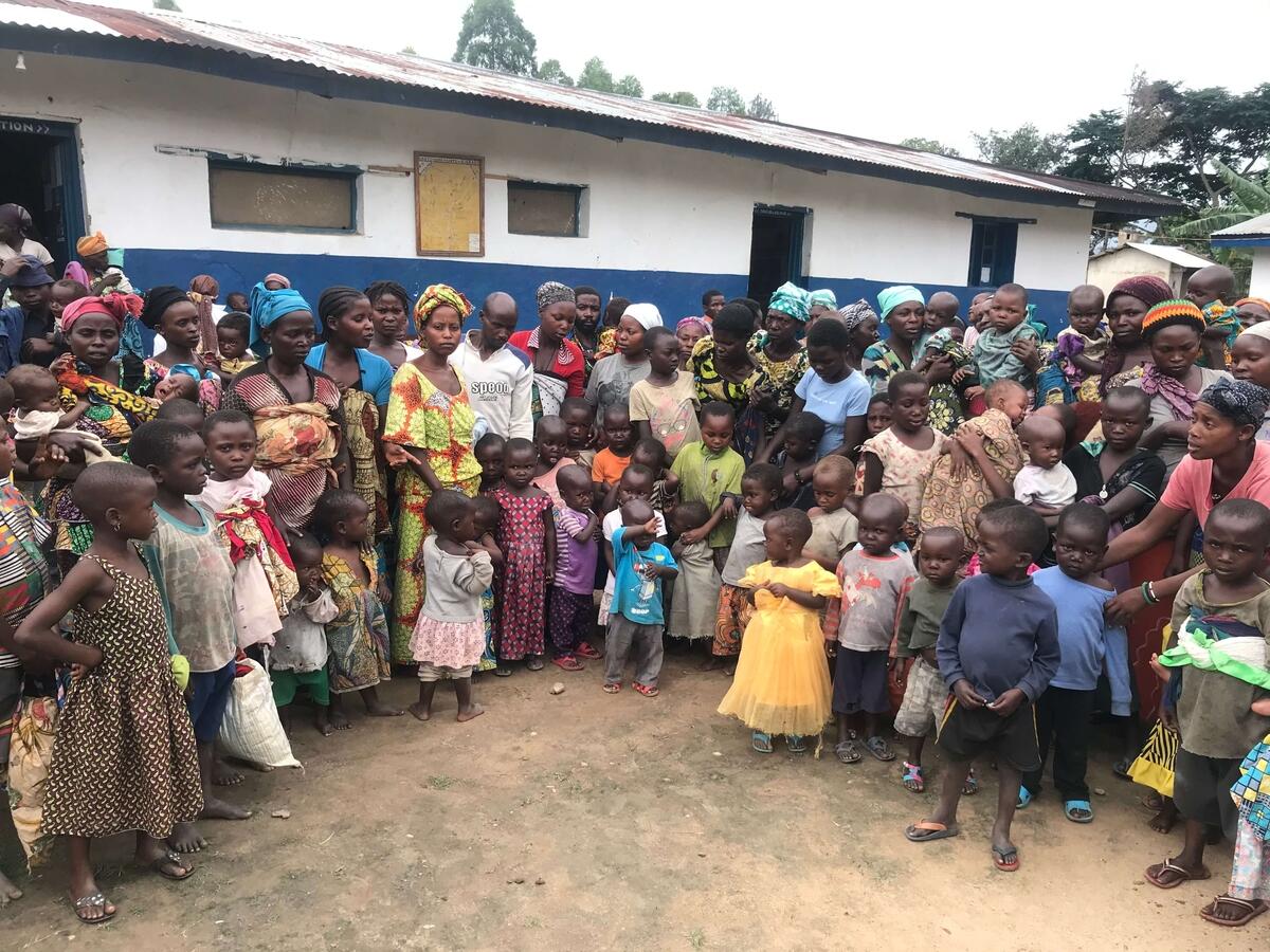 Parents of Binza line up at a clinic