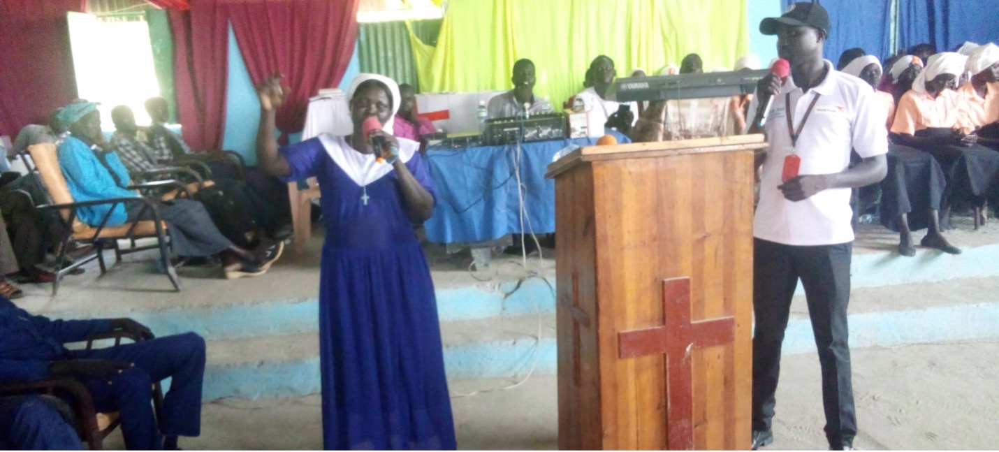 Nyabila, shares gender-based violence prevention and the importance of shared roles in families during a church Mass.
