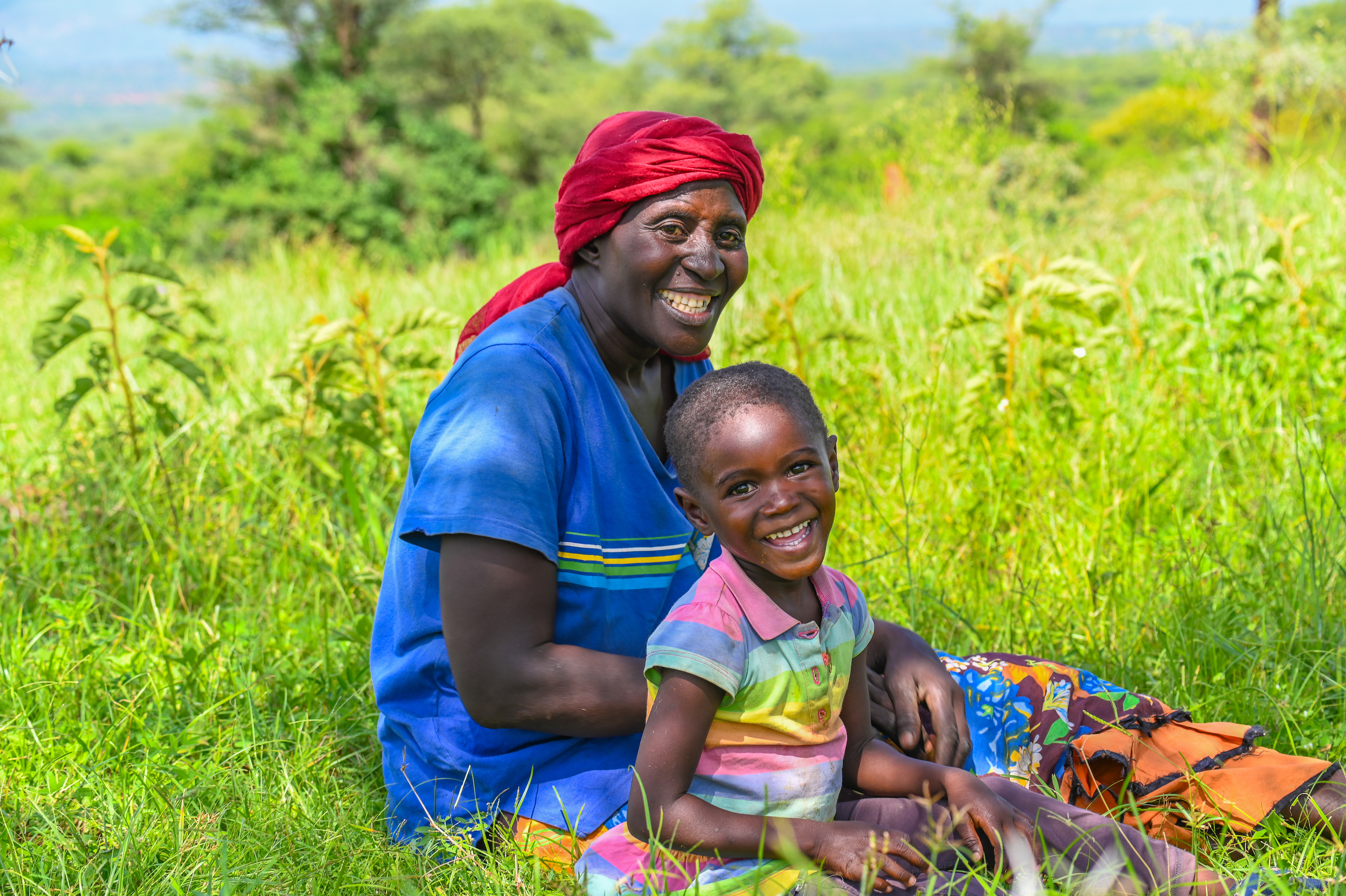 Joyce Wanyama and her granddaughter, Blessing enjoying some leisure time under the shade.