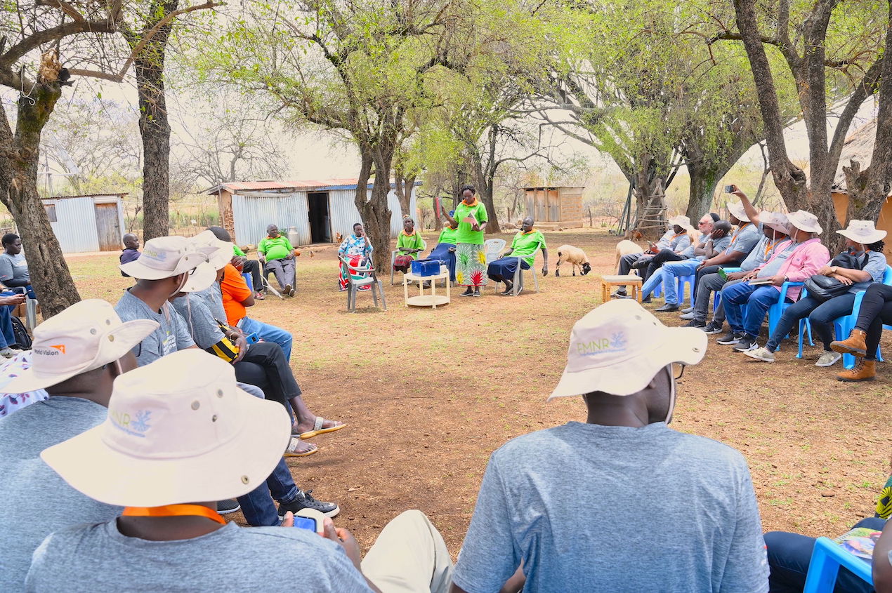 Kuresie Savings for Transformation (S4T) group demonstrating how their S4T sessions are conducted to guests at Nancy’s homestead. Nancy and her husband are members of the savings group. ©World Vision Photo/Hellen Owuor.