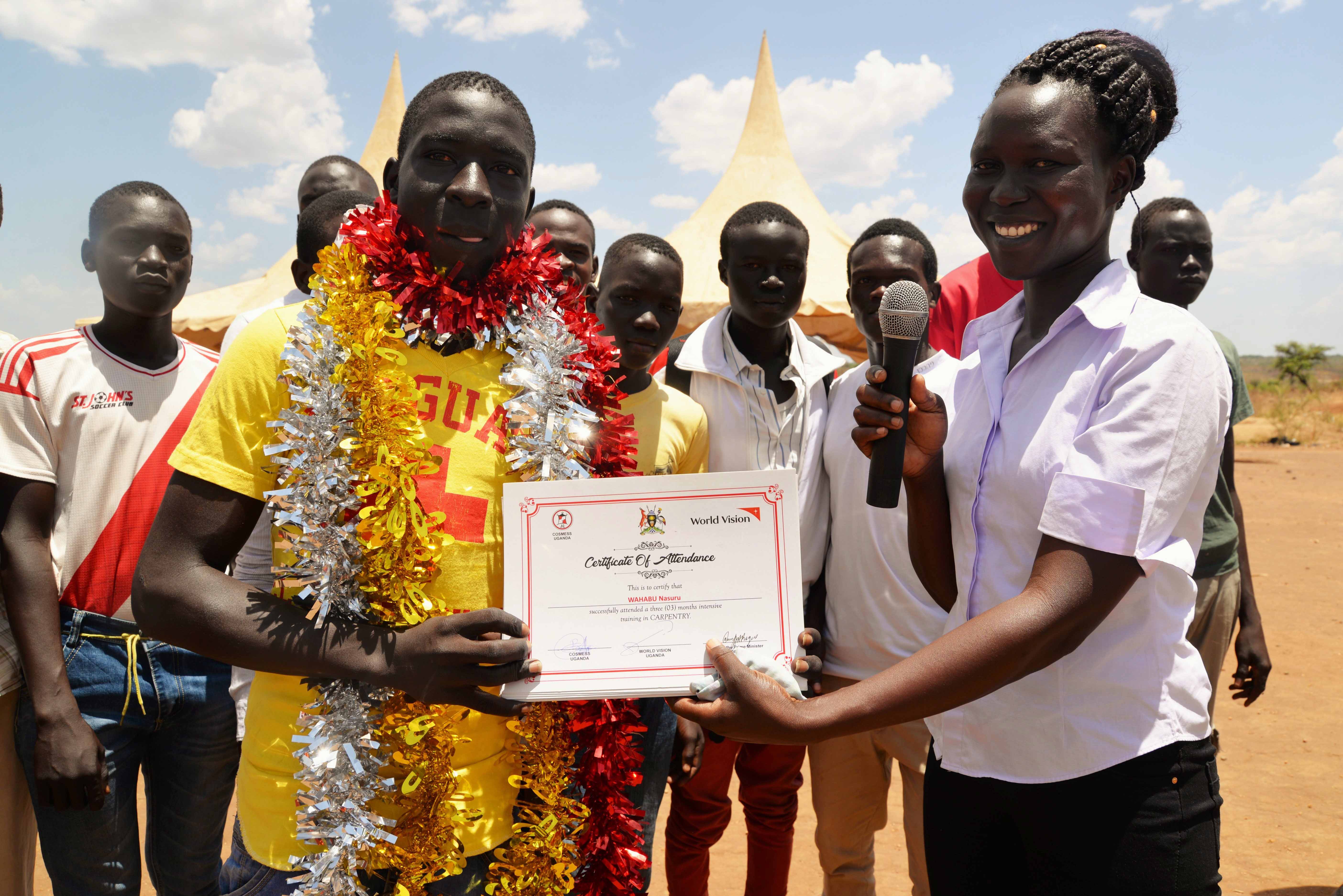 Participants receiving their certificates of completion