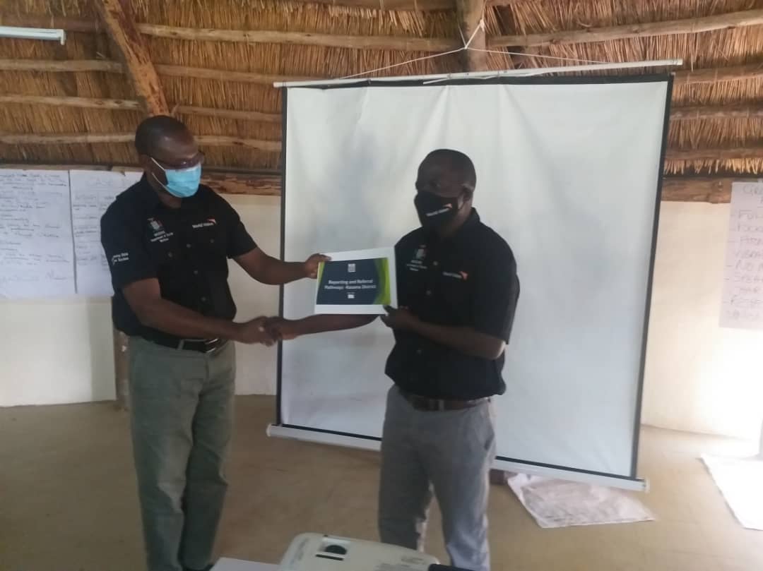 Left to Right, Mr. Kelly Kashiwa-DC Kasama and Mr. Charles Matowa Phiri Mwamba Cluster Manager during the handover of the developed child protection referral pathways for Mporokoso, Mungwi and Kasama districts.