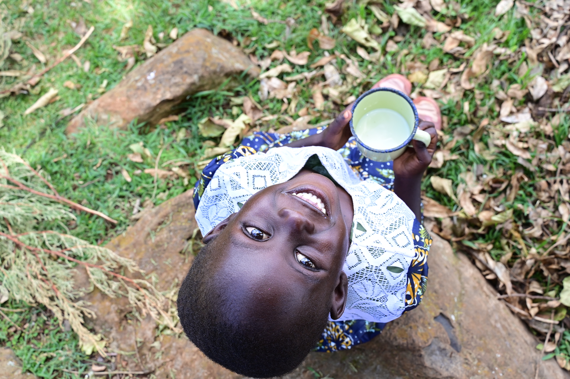 Lazarus’ grand-daughter, Velmur aged 4 enjoys drinking nutritious milk that is  important for development of strong, healthy bones and teeth. ©World Vision photo/Hellen Owuor.