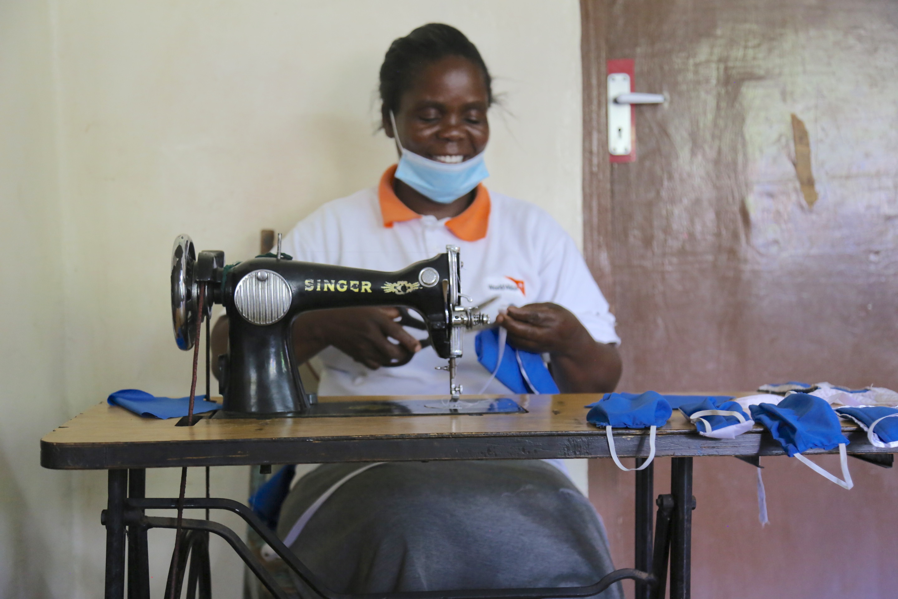 Anne Rengo, a tailor and a Community Children Officer in Matete, Kakamega County, sewing masks for children to protect them from  getting COVID-19