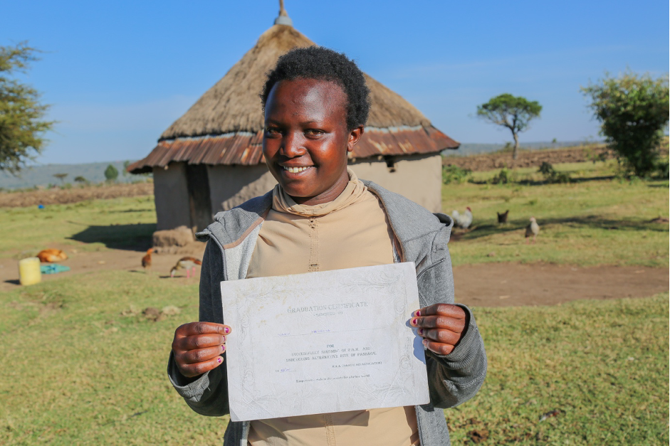 Zipporah displays her Graduation certificate, having been trained on FGM and Alternative Rite of Passage in Kirindon, Narok, Kenya. 