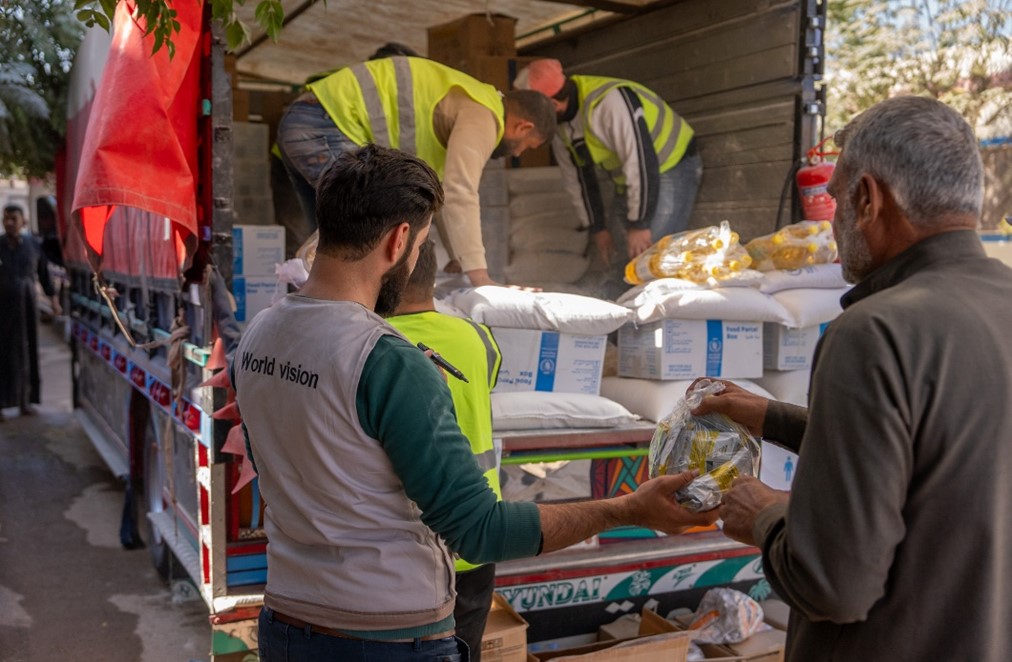 Abu Ali feeds his child nutritional supplements. World Vision Syria Response - Zaher Jaber
