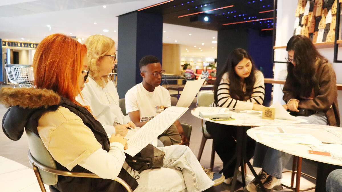 Young people reviewing their call to action