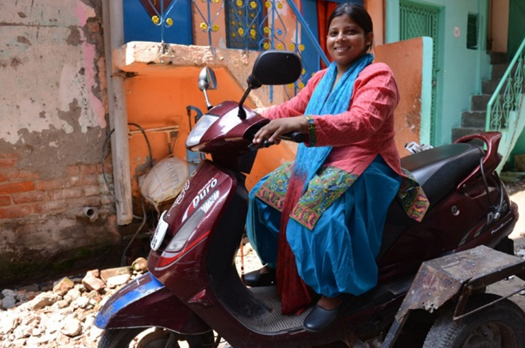 Rekha Kumari sitting on a moped