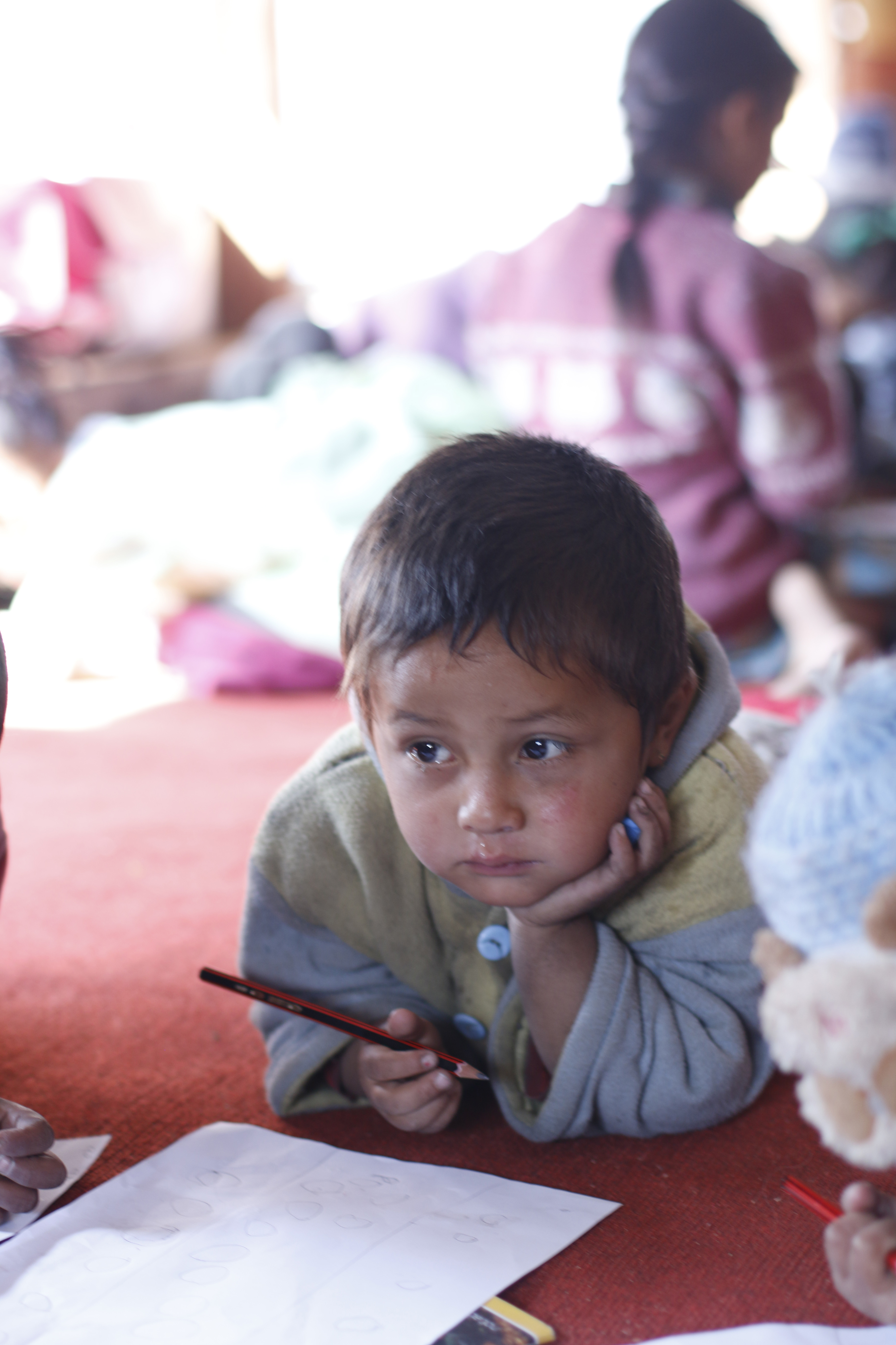 Children drawing in reading camp