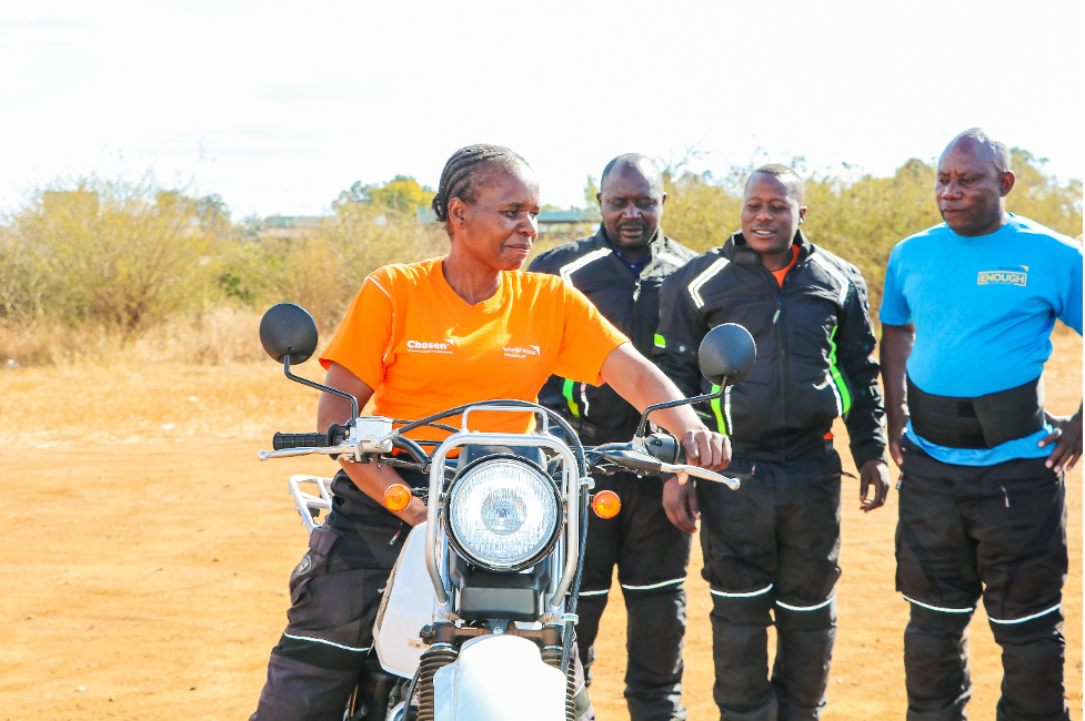 Rosemary demonstrating how to safely sit on a motorcycle