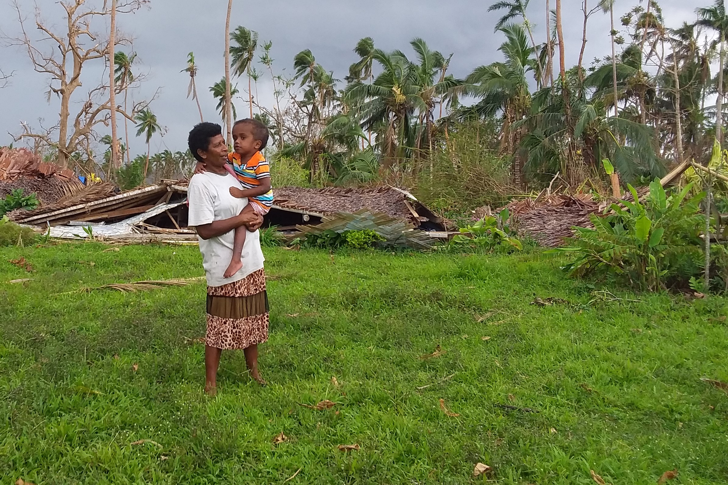 Rose and Rara in front of the flattened kindergarten where Rose works.